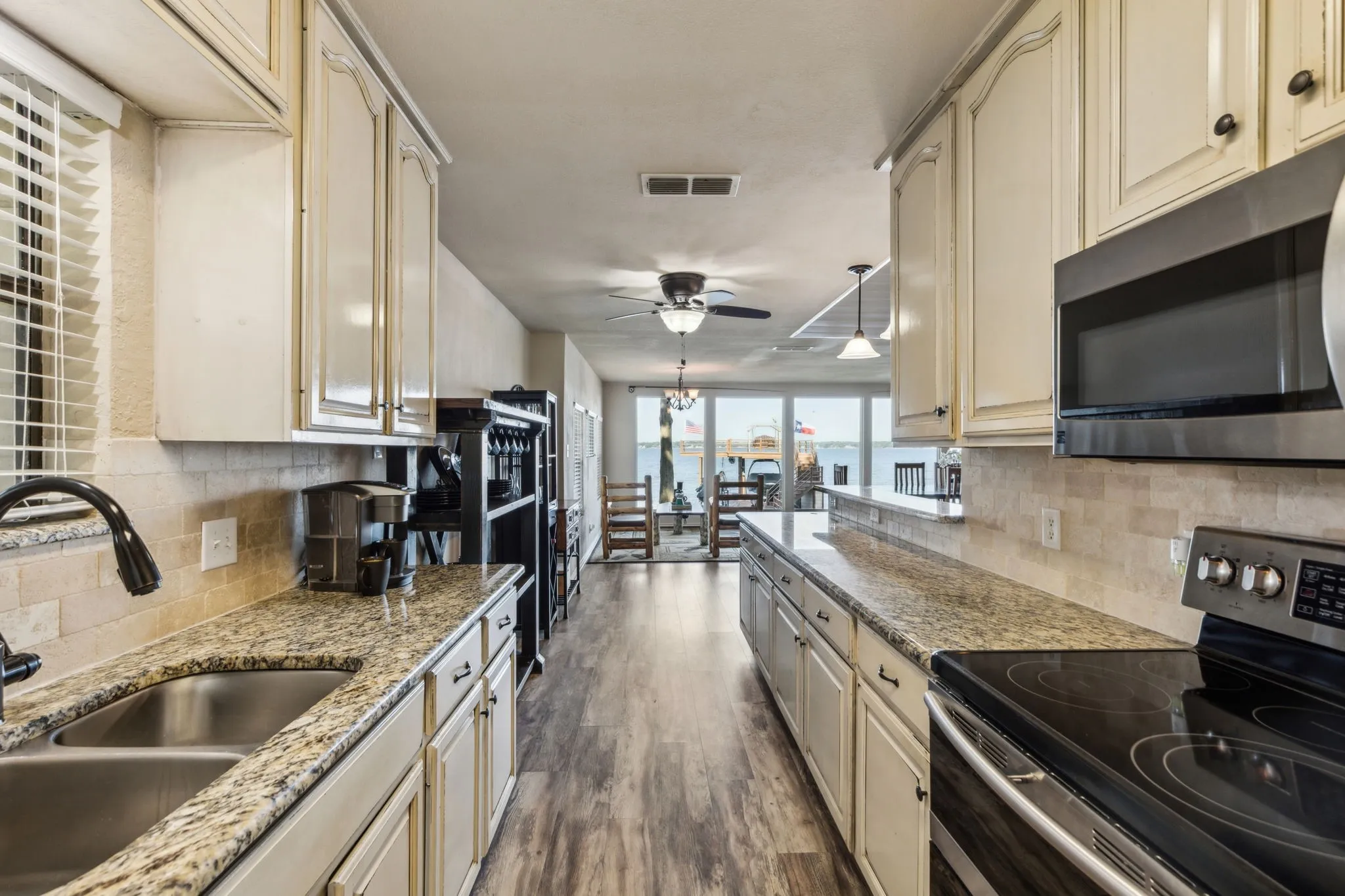 Galley kitchen with ample counterspace and storage.