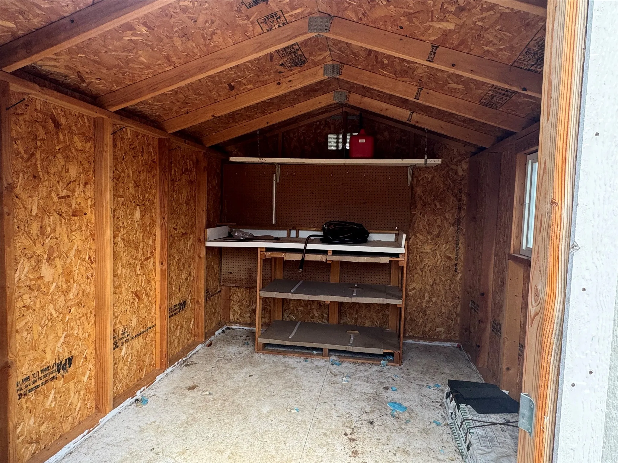 Inside of out building with shelves
