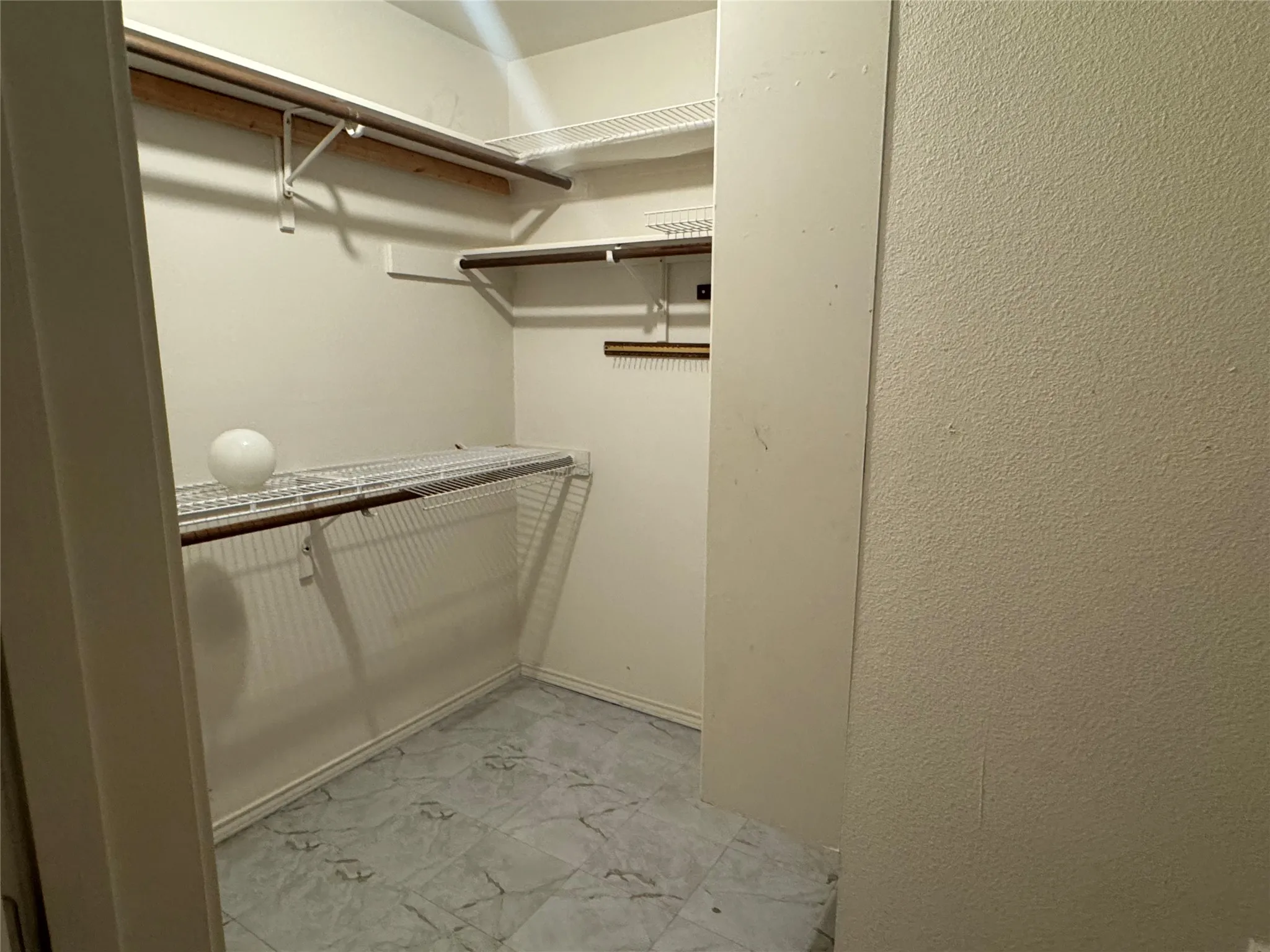 Large bedroom closet located in ensuite bathroom