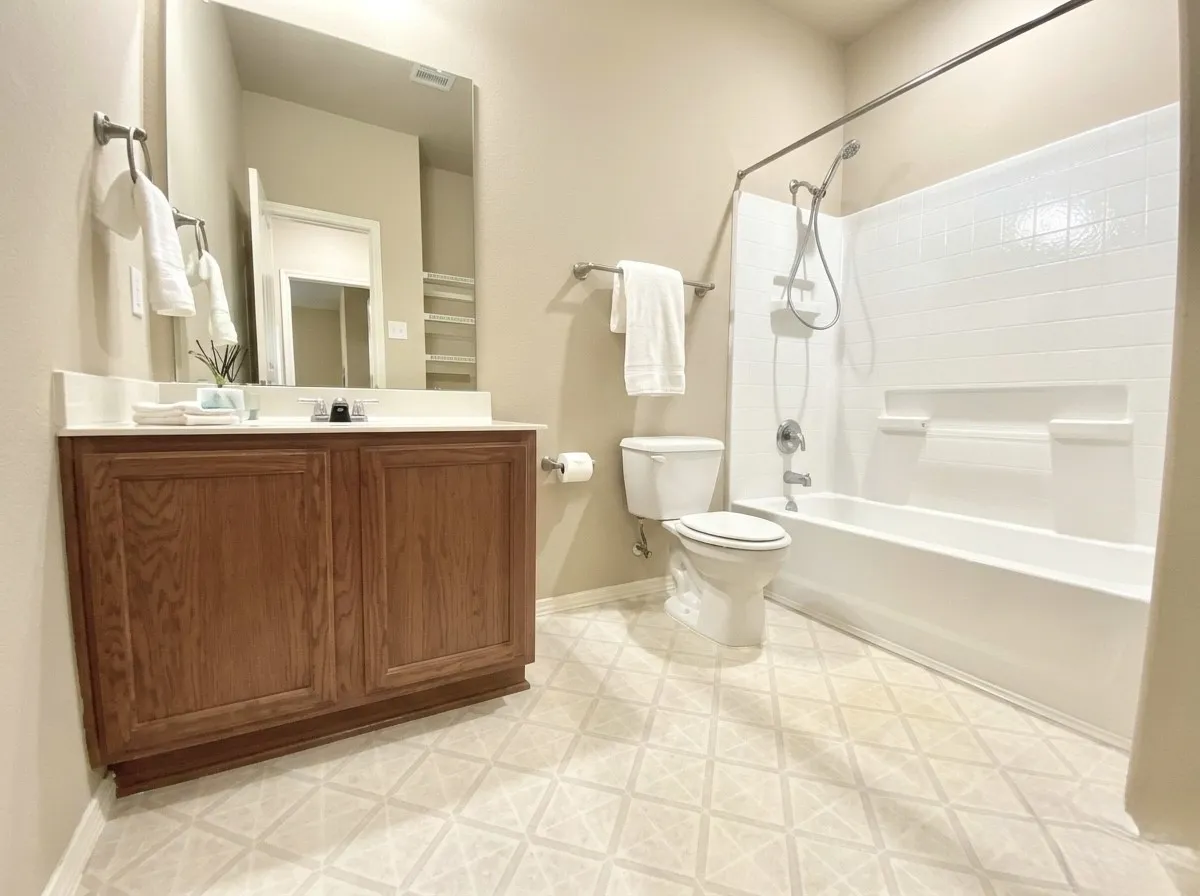 Bathroom featuring vanity and shower / bathtub combination