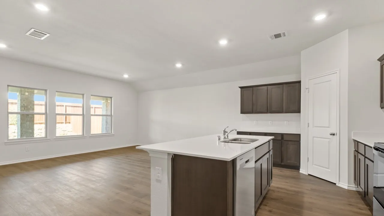 Open-concept area featuring wood-finish flooring, white walls, and recessed lighting