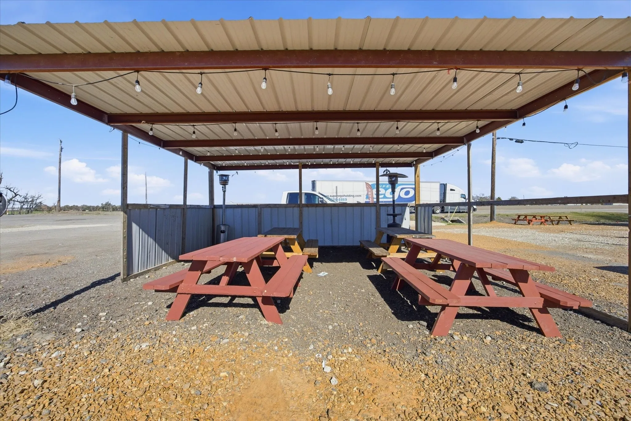 Picnic tables are included for each space.