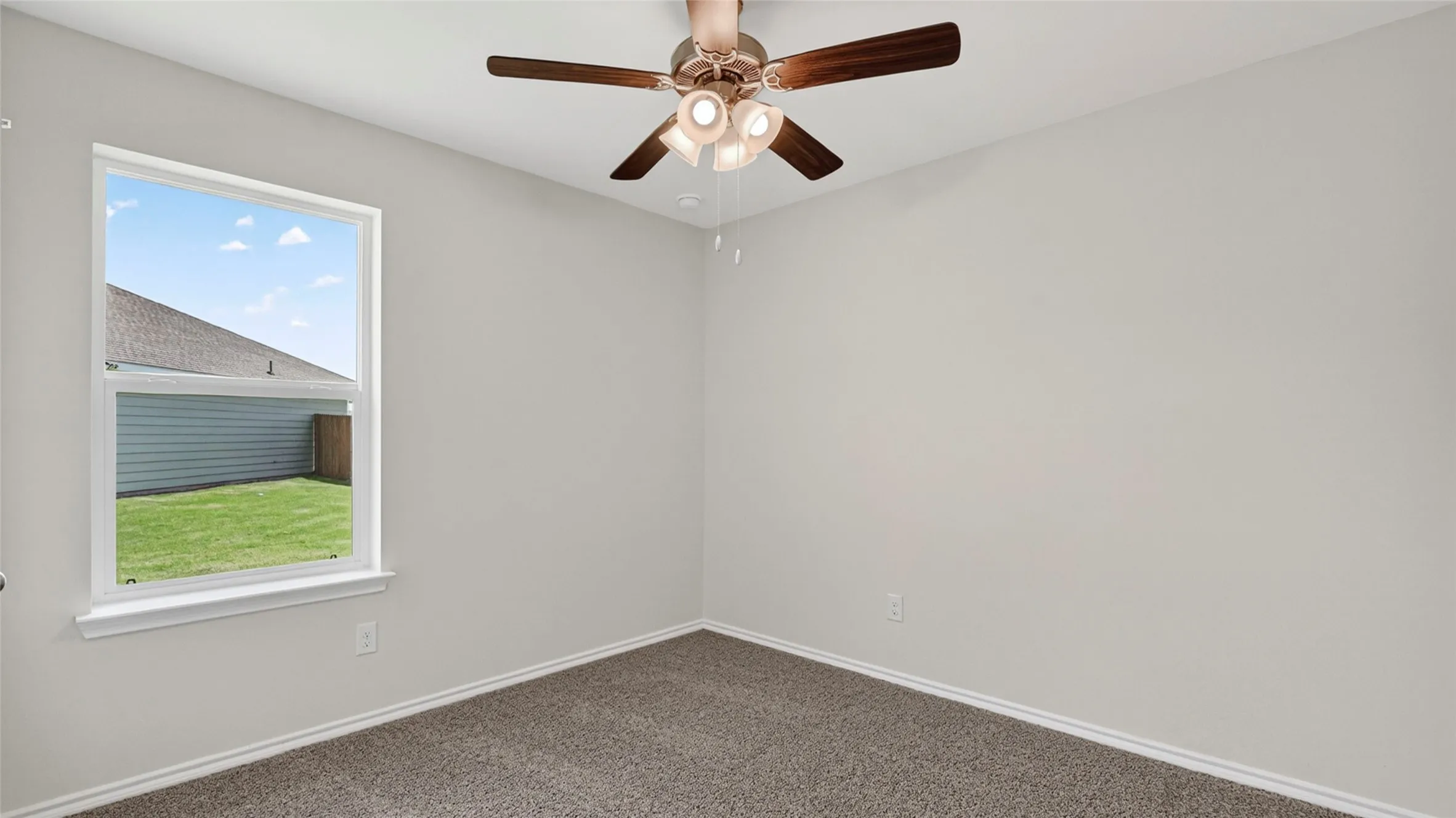 Neutral-toned walls complement plush carpeting