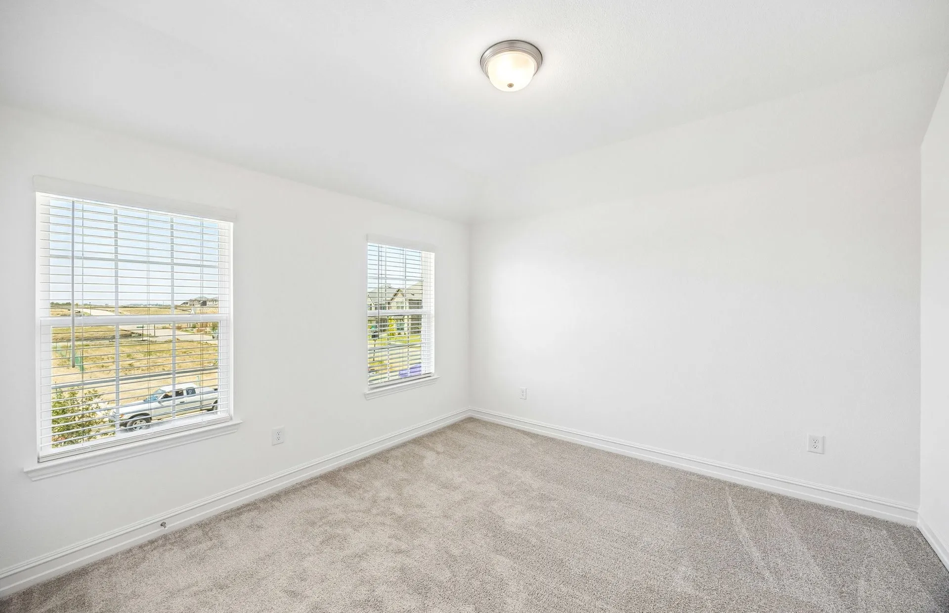 Secondary bedroom with large windows