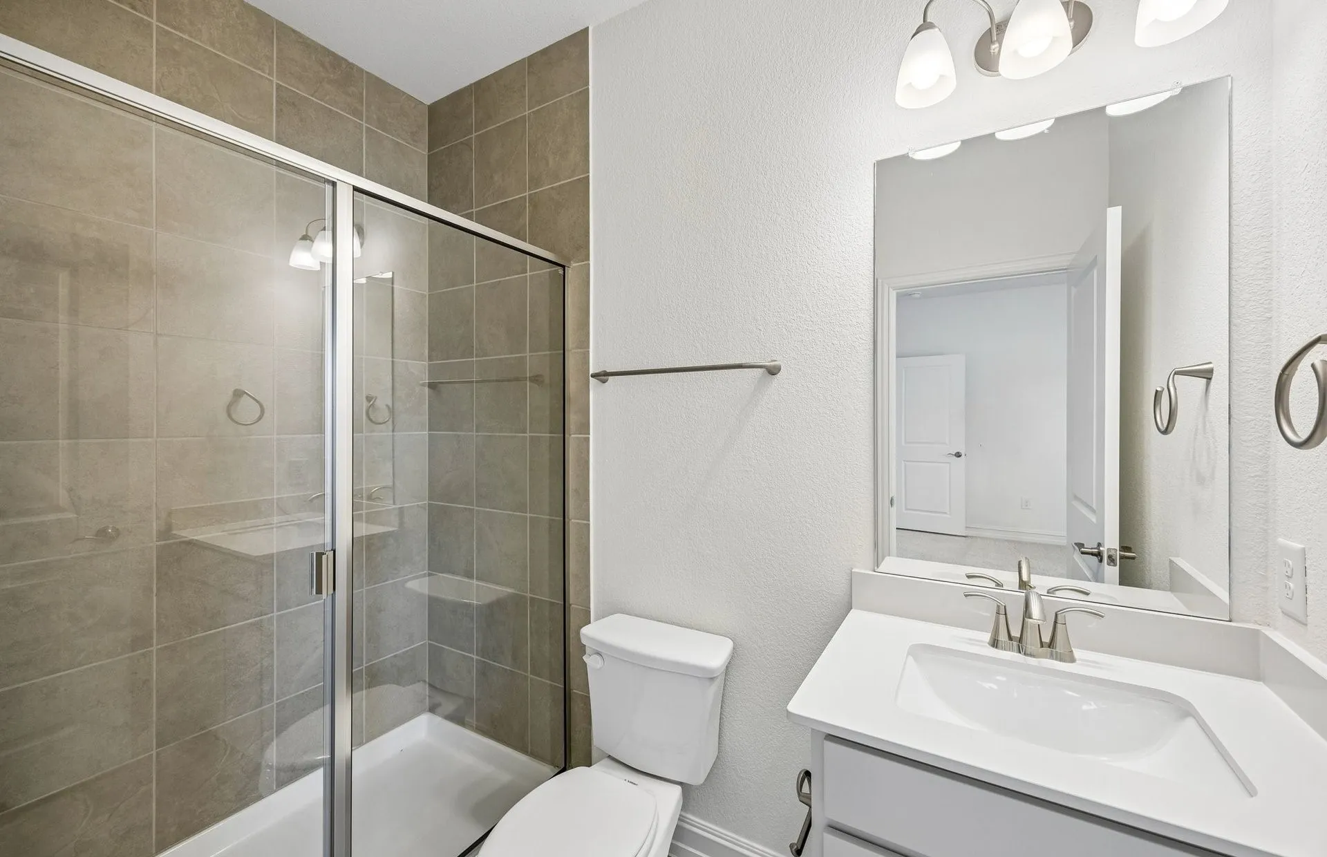 Secondary bath with tile surrounded shower