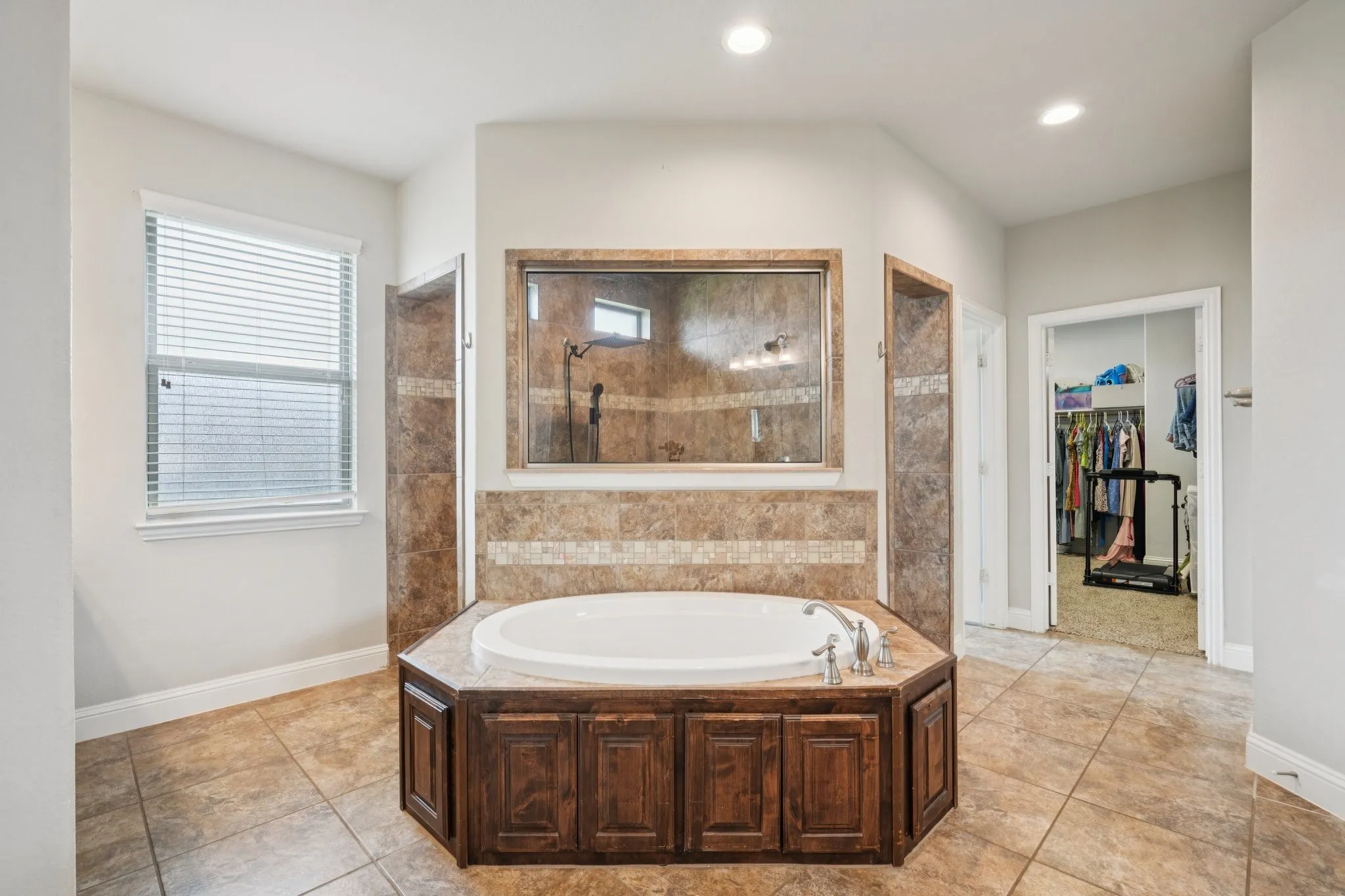 Primary bathroom featuring a jetted tub.