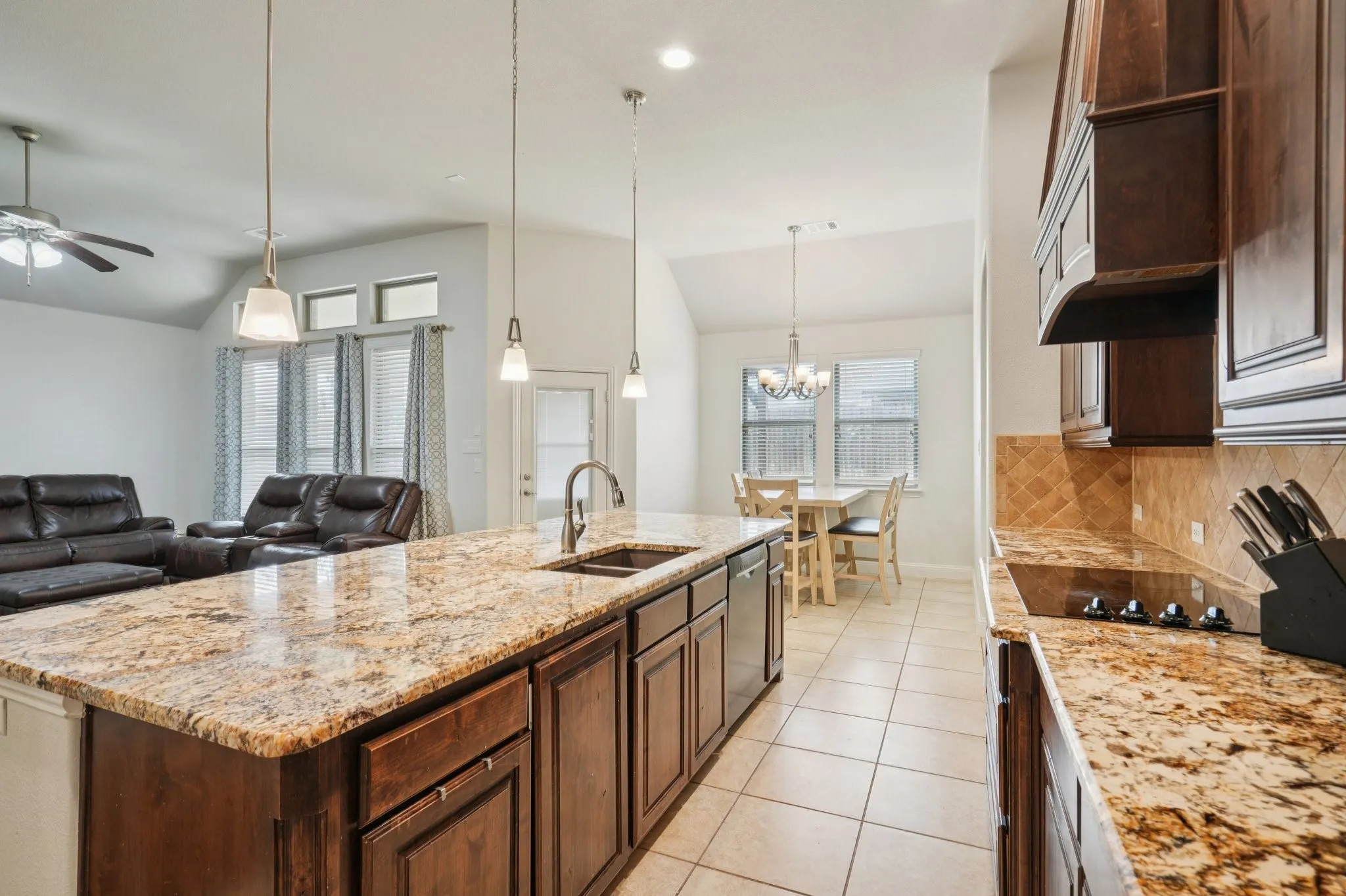 Kitchen with electric appliances and ample countertop space.