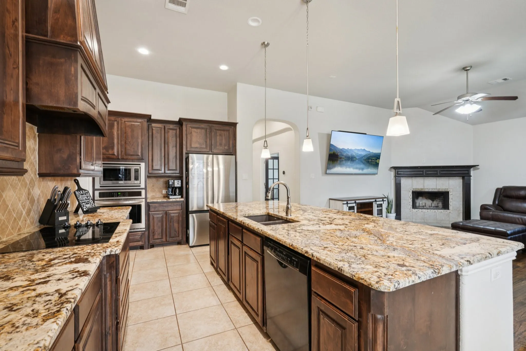 Kitchen with countertops and open view to the living room.