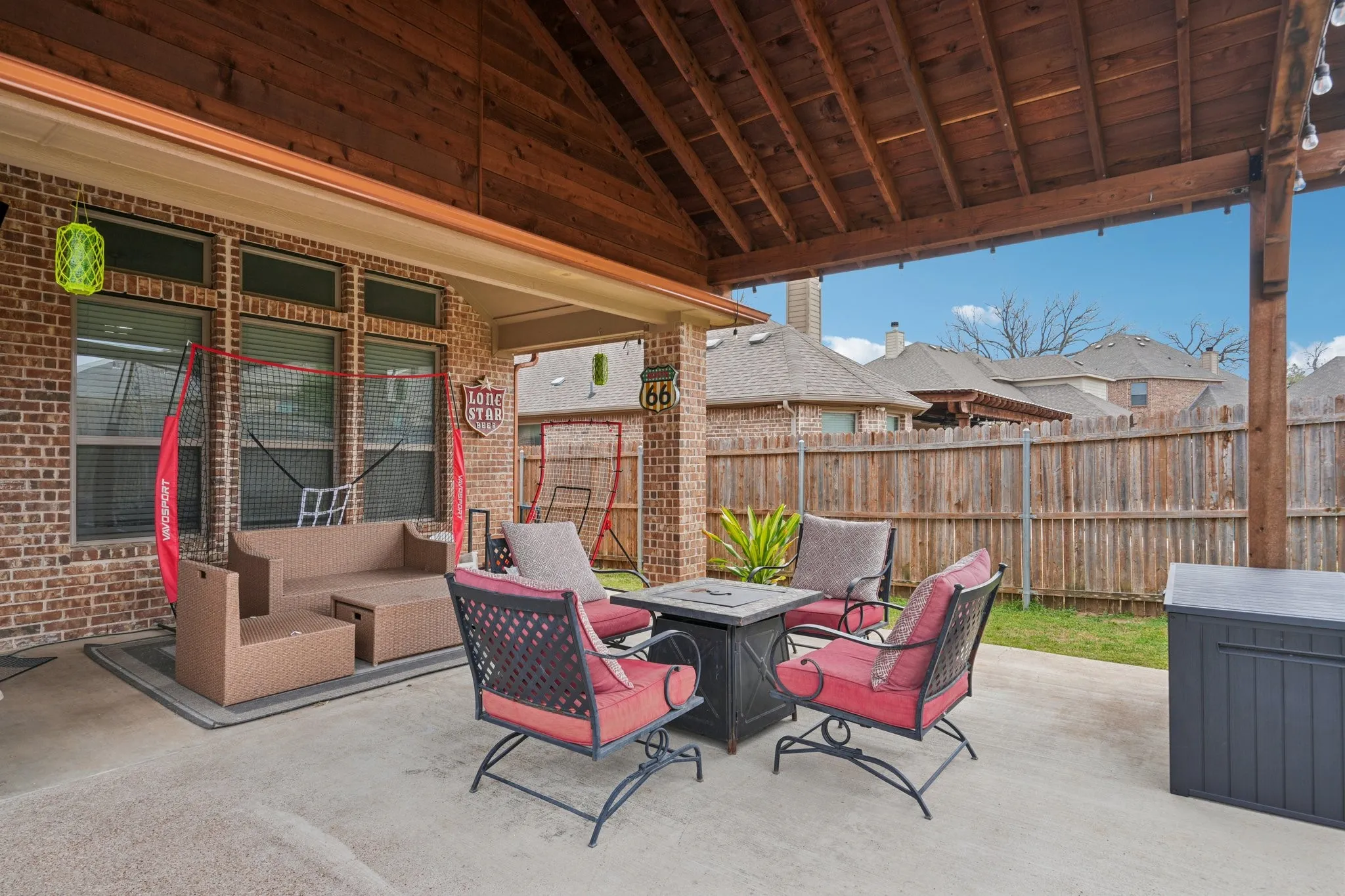 Covered patio with outdoor seating, ideal for relaxing and entertaining.