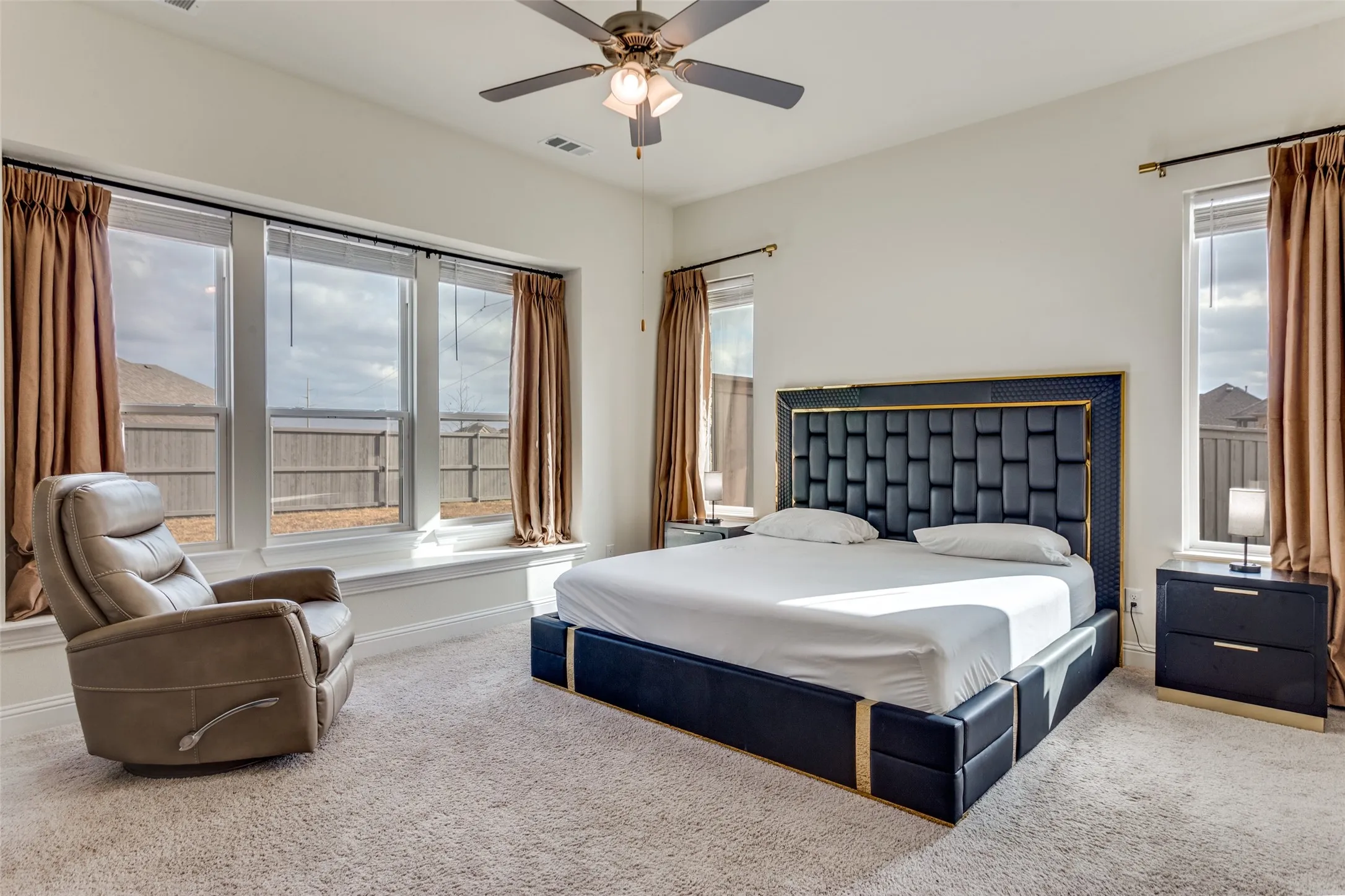 Bedroom with carpet and a ceiling fan