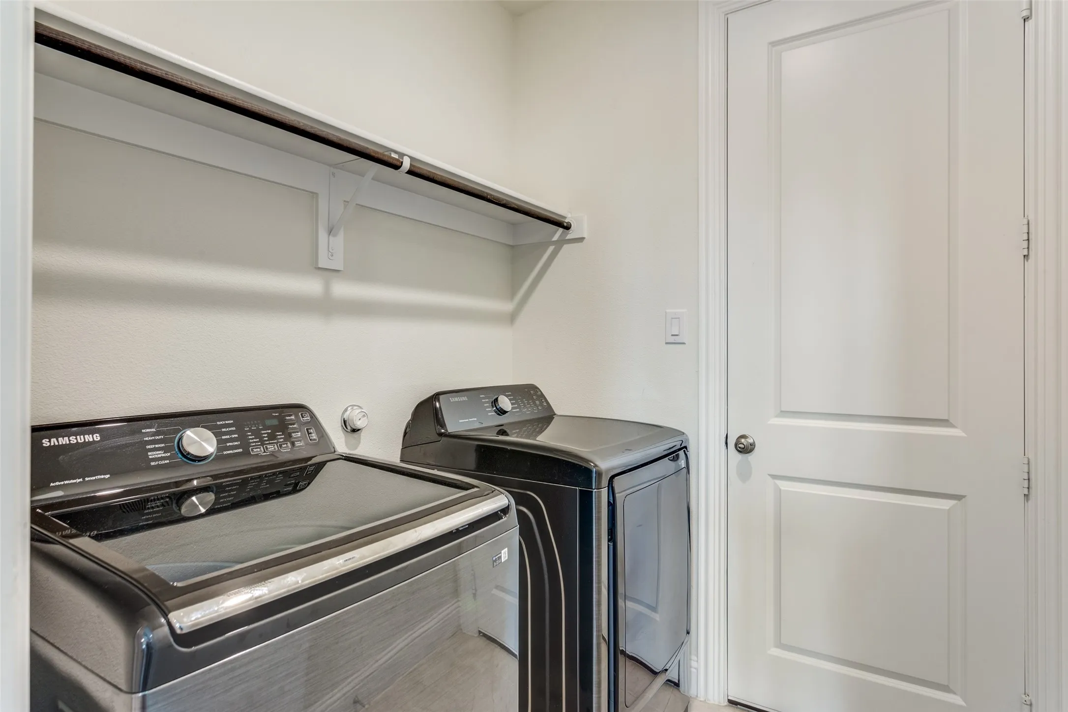 Laundry area with washer and clothes dryer