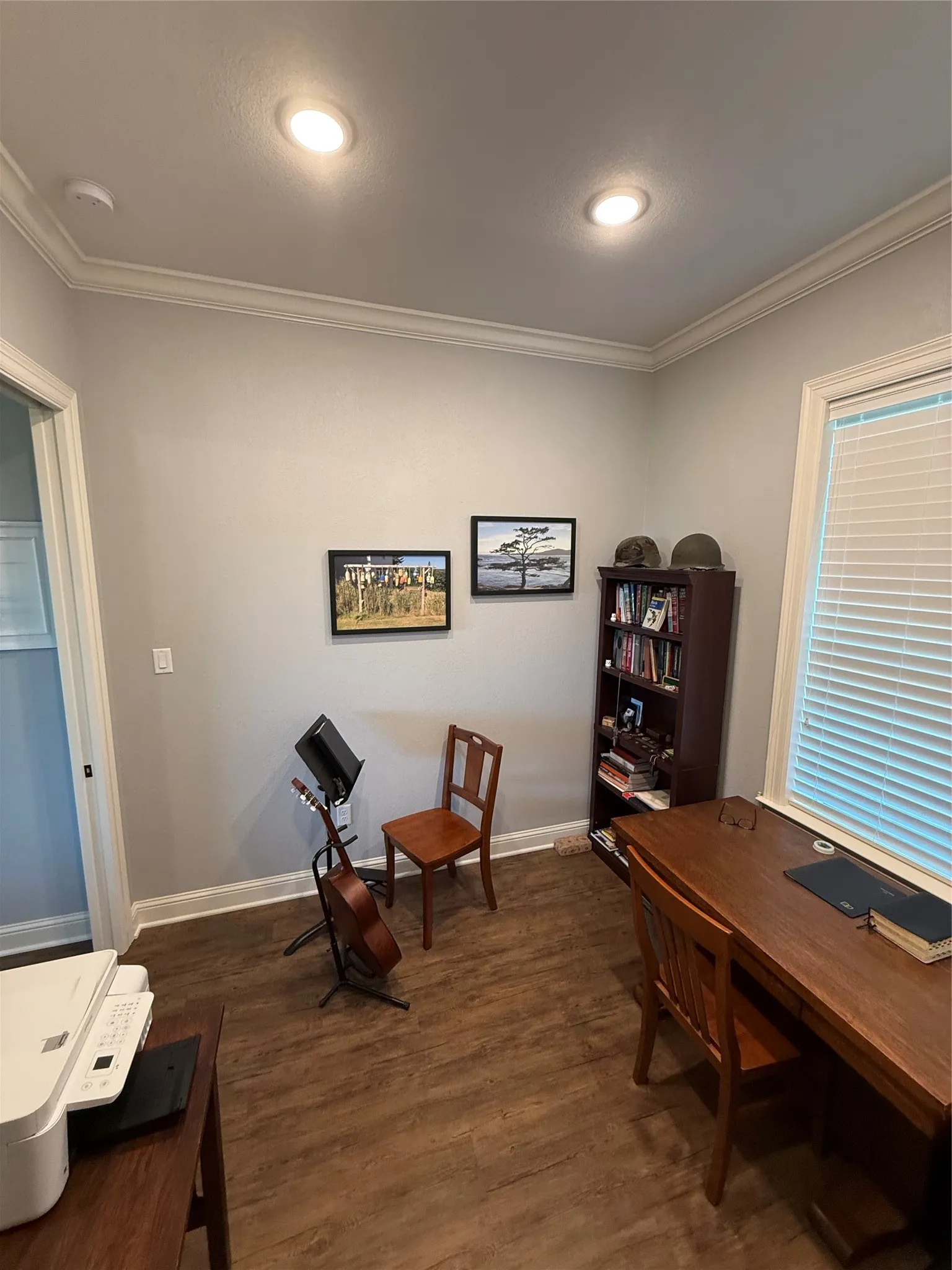 Home office with ornamental molding, dark wood-type flooring, baseboards, and recessed lighting