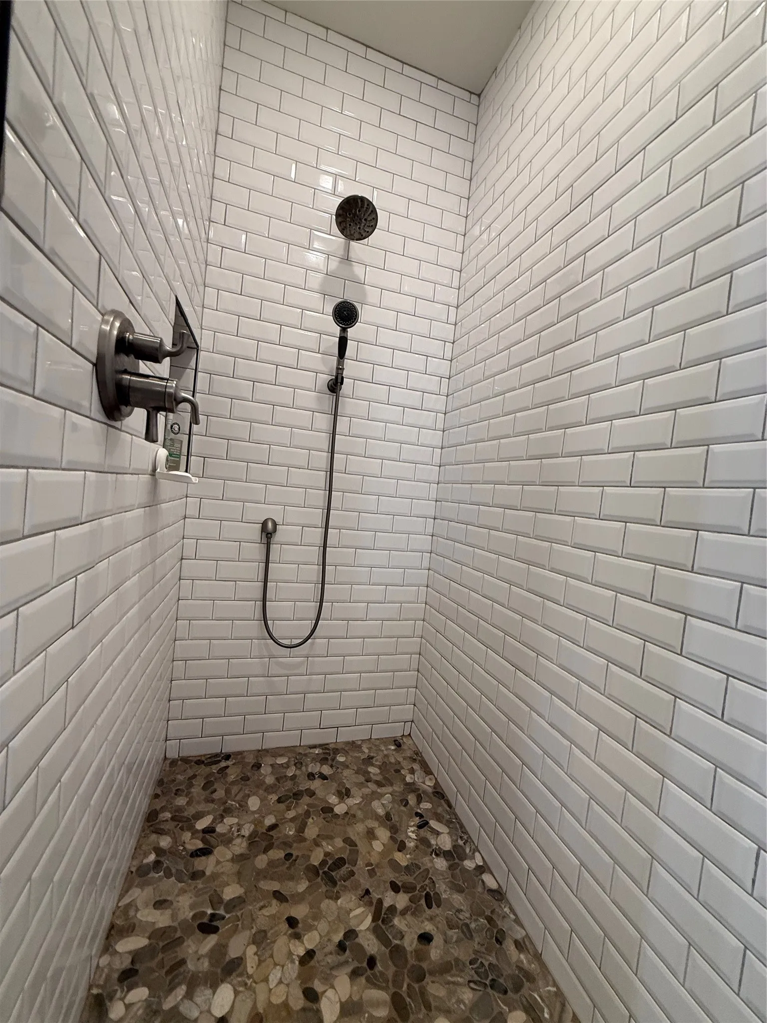 Bathroom featuring tiled shower
