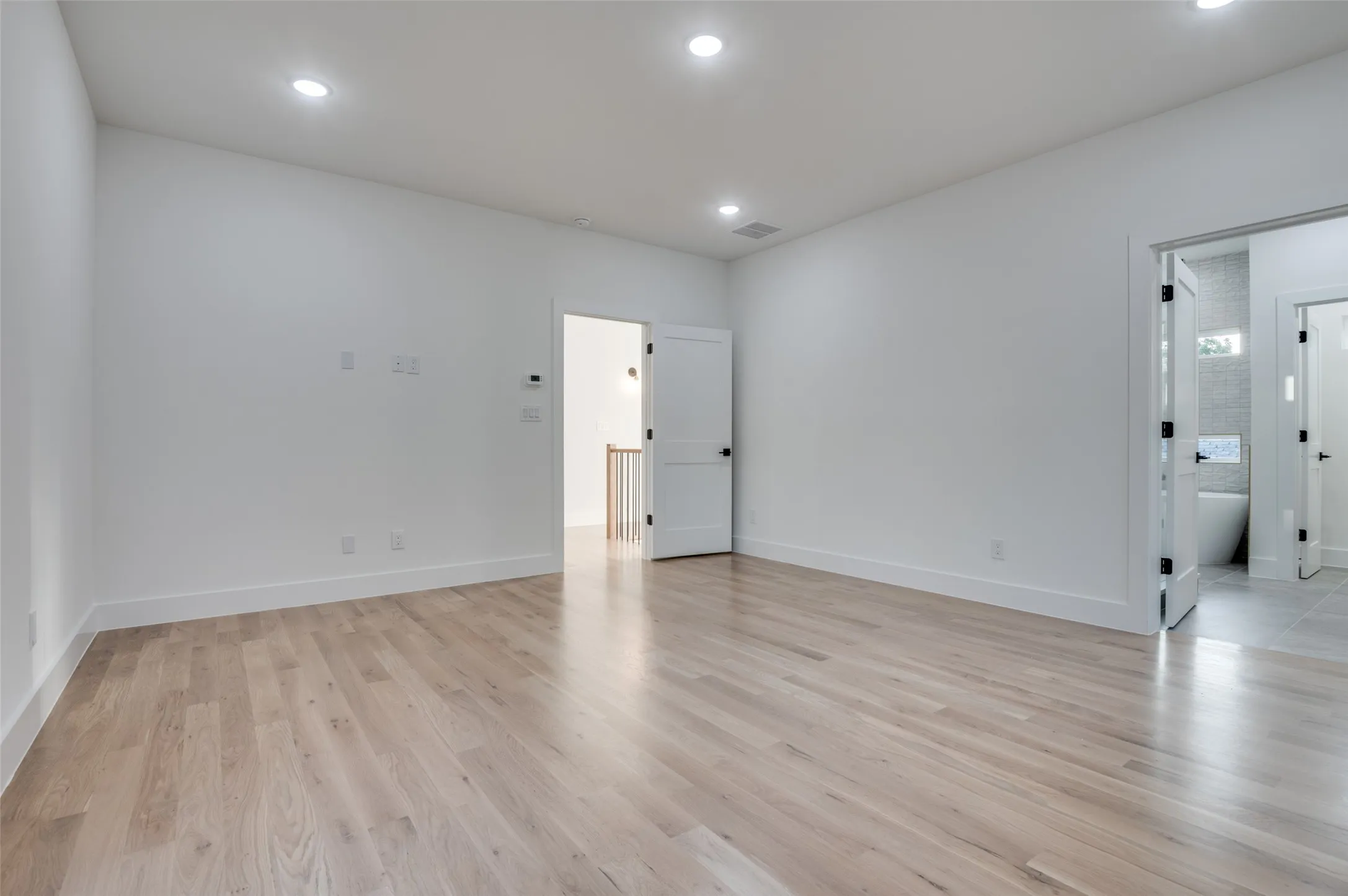 Unfurnished room featuring light wood-style floors and recessed lighting