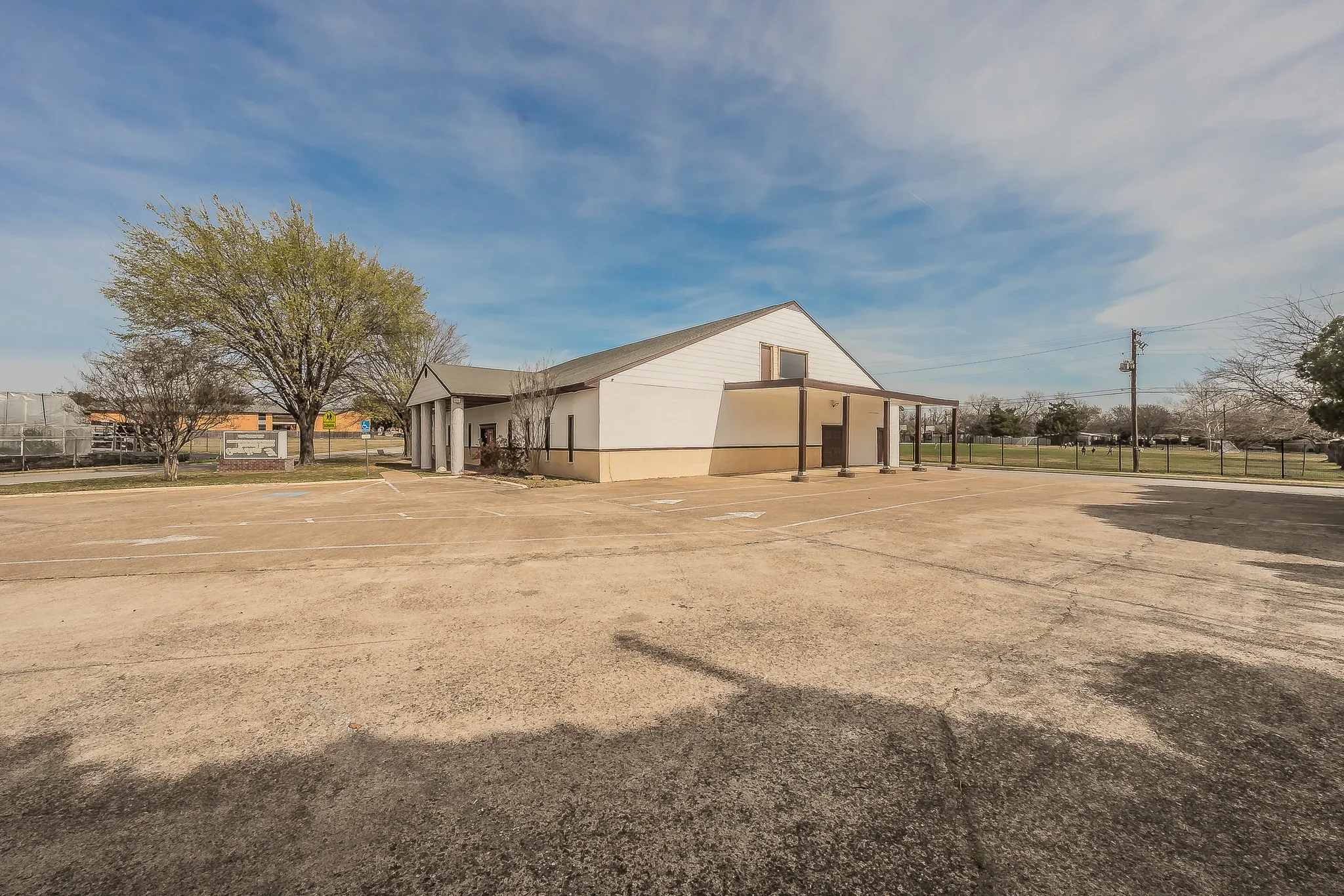 side of structure with covered drive