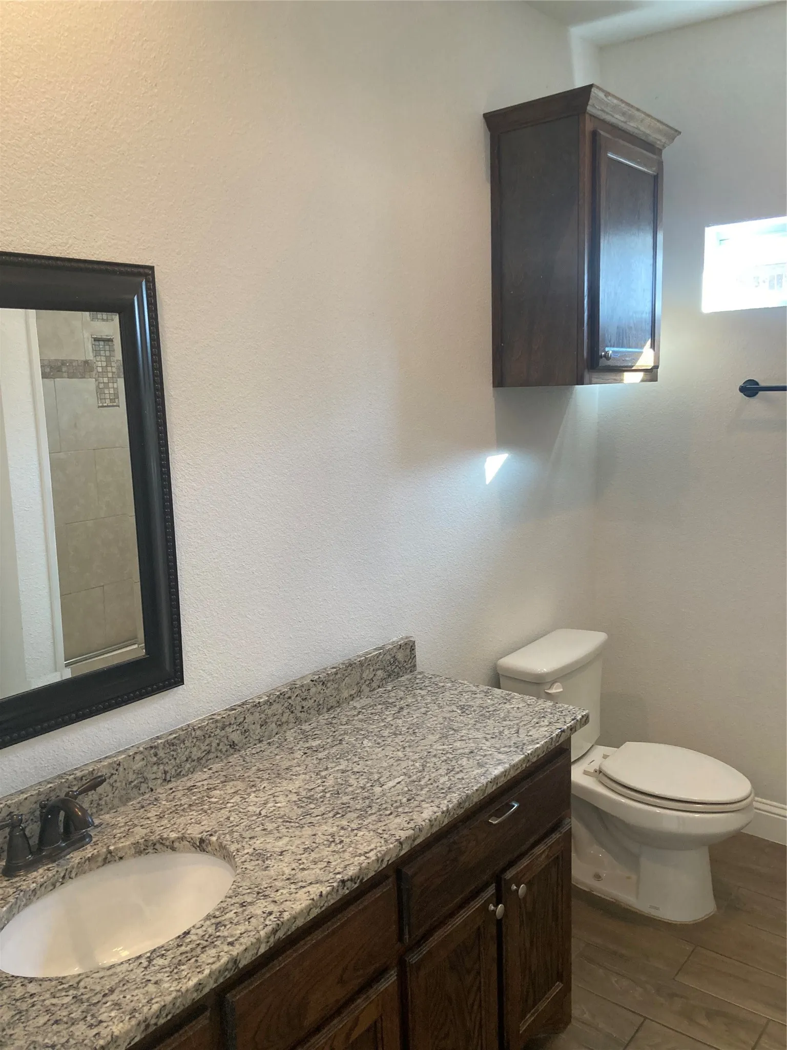 Bathroom #2 vanity has granite countertop.