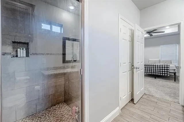 Primary bathroom has a large walk in shower.