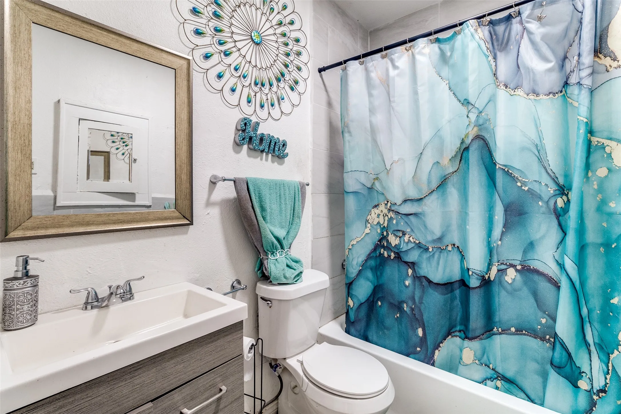 Bathroom with vanity and shower / bath combo