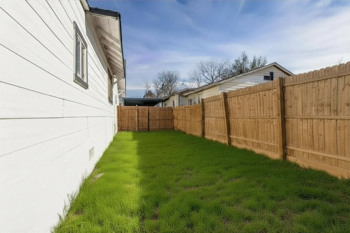 View of fenced backyard