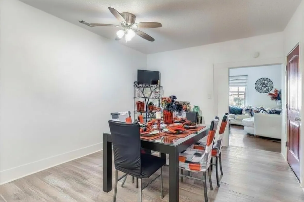 Dining room with light wood finished floors and ceiling​​‌​​​​‌​​‌‌​‌‌​​​‌‌​‌​‌​‌​​​‌​​ fan