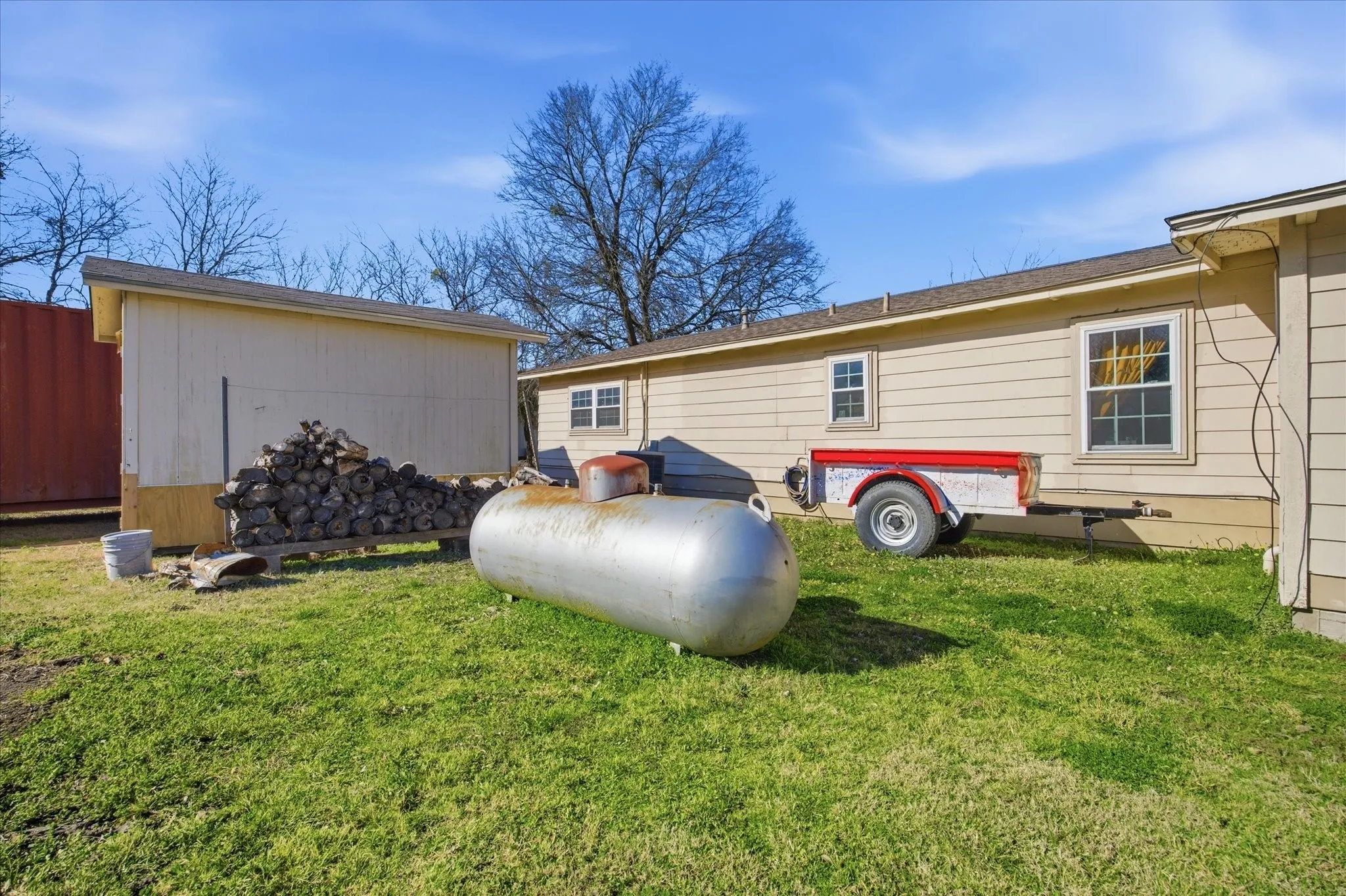 The propane tank is owned and conveys with the property.