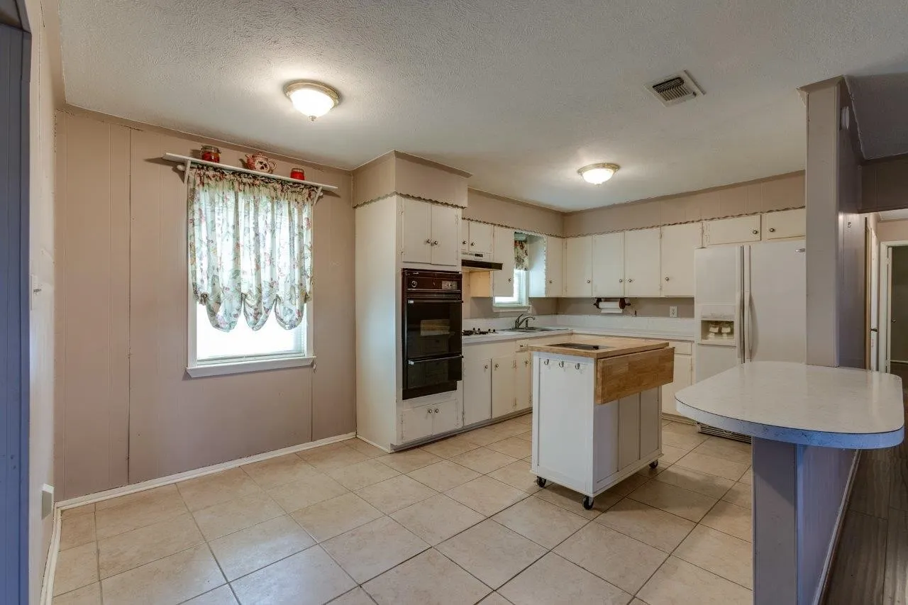 Kitchen and breakfast nook (photo from 2023, currently tenant occupied).