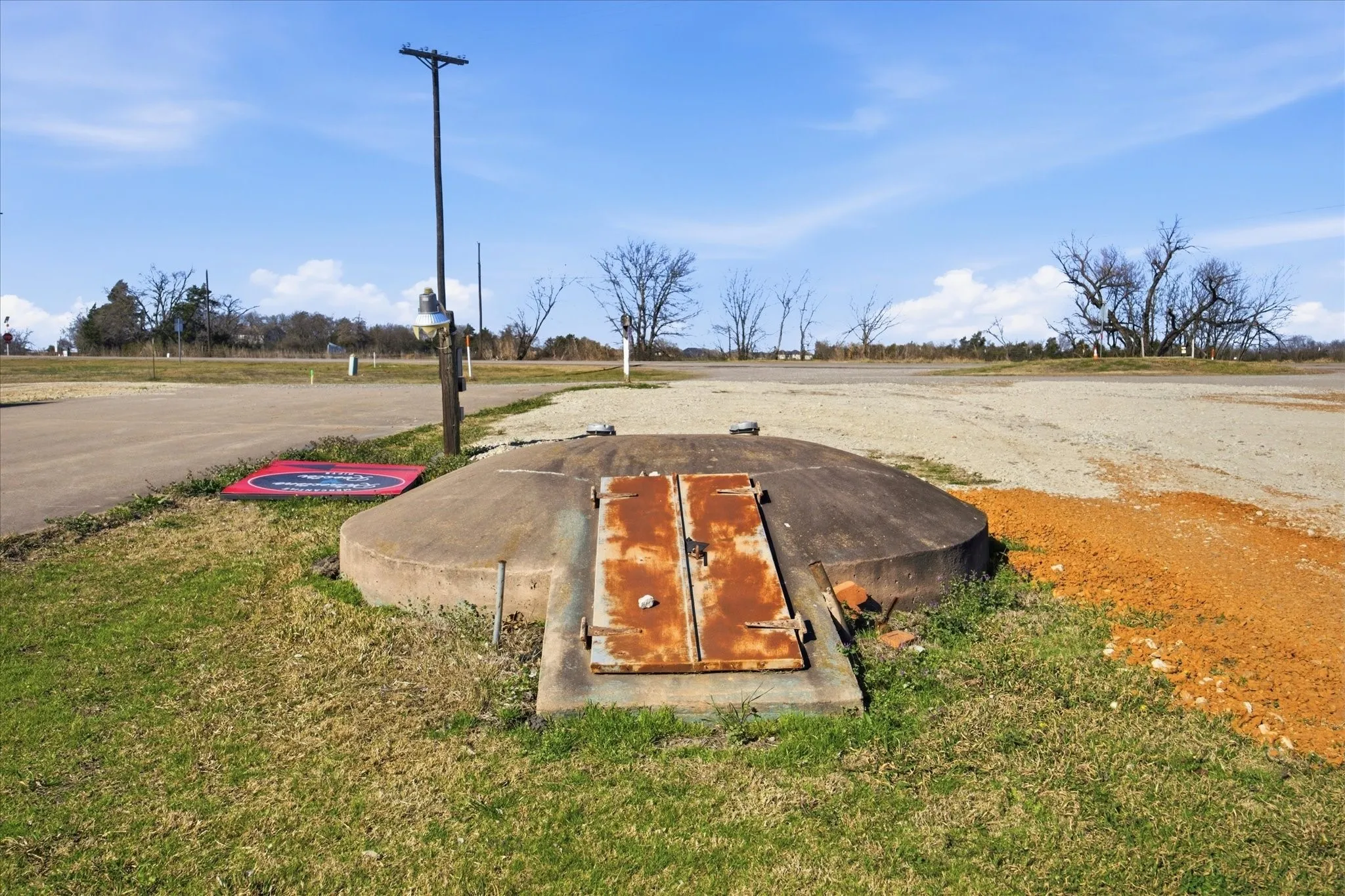 The 15-person storm shelter is located between the house and food truck court.