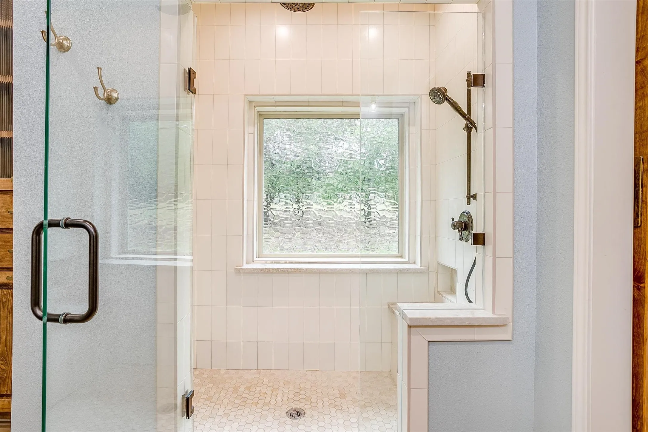 Full bathroom featuring a stall shower