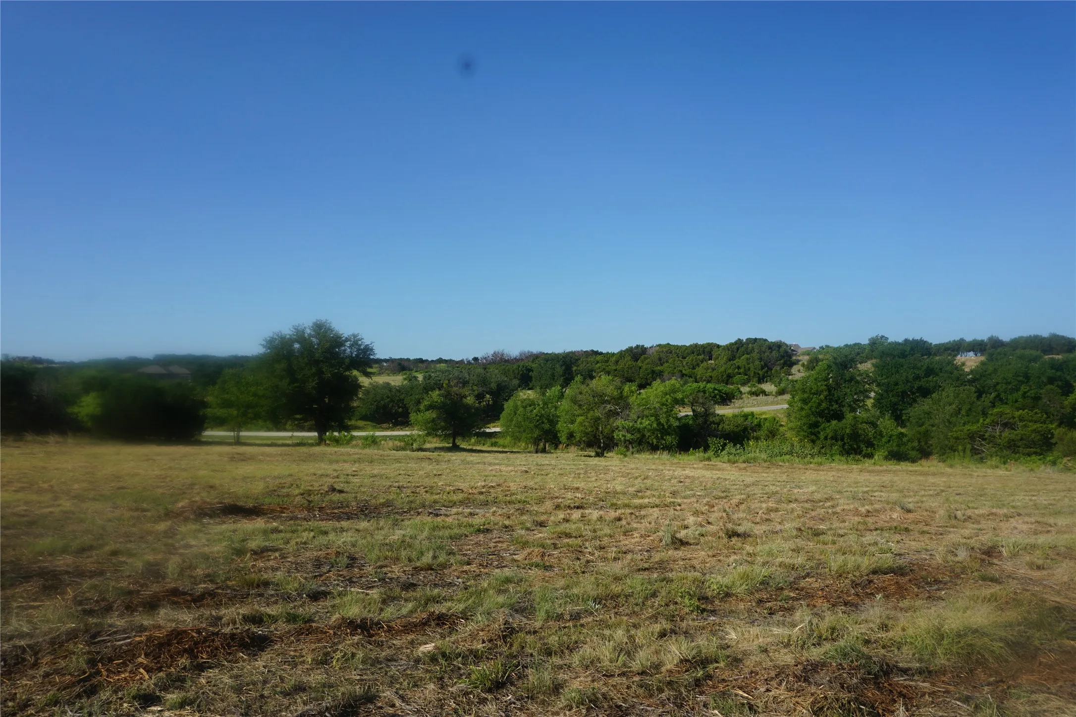 A view on the property of Enchanted Rock Court heading up to the cul-de-sac.  Sights and sounds of nature all around!