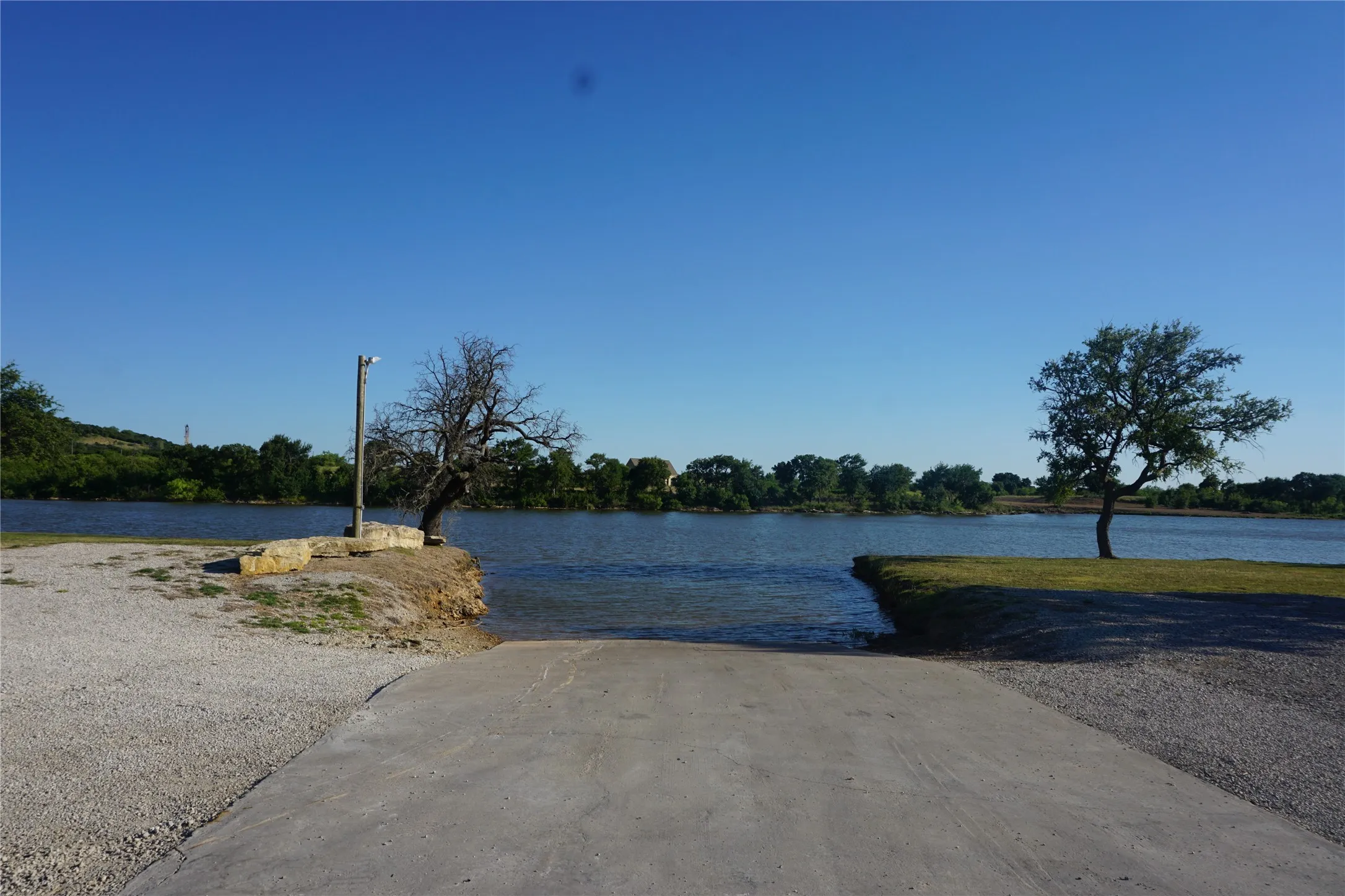 Community watercraft launch is wide, gently sloped, and concreted for ease of access