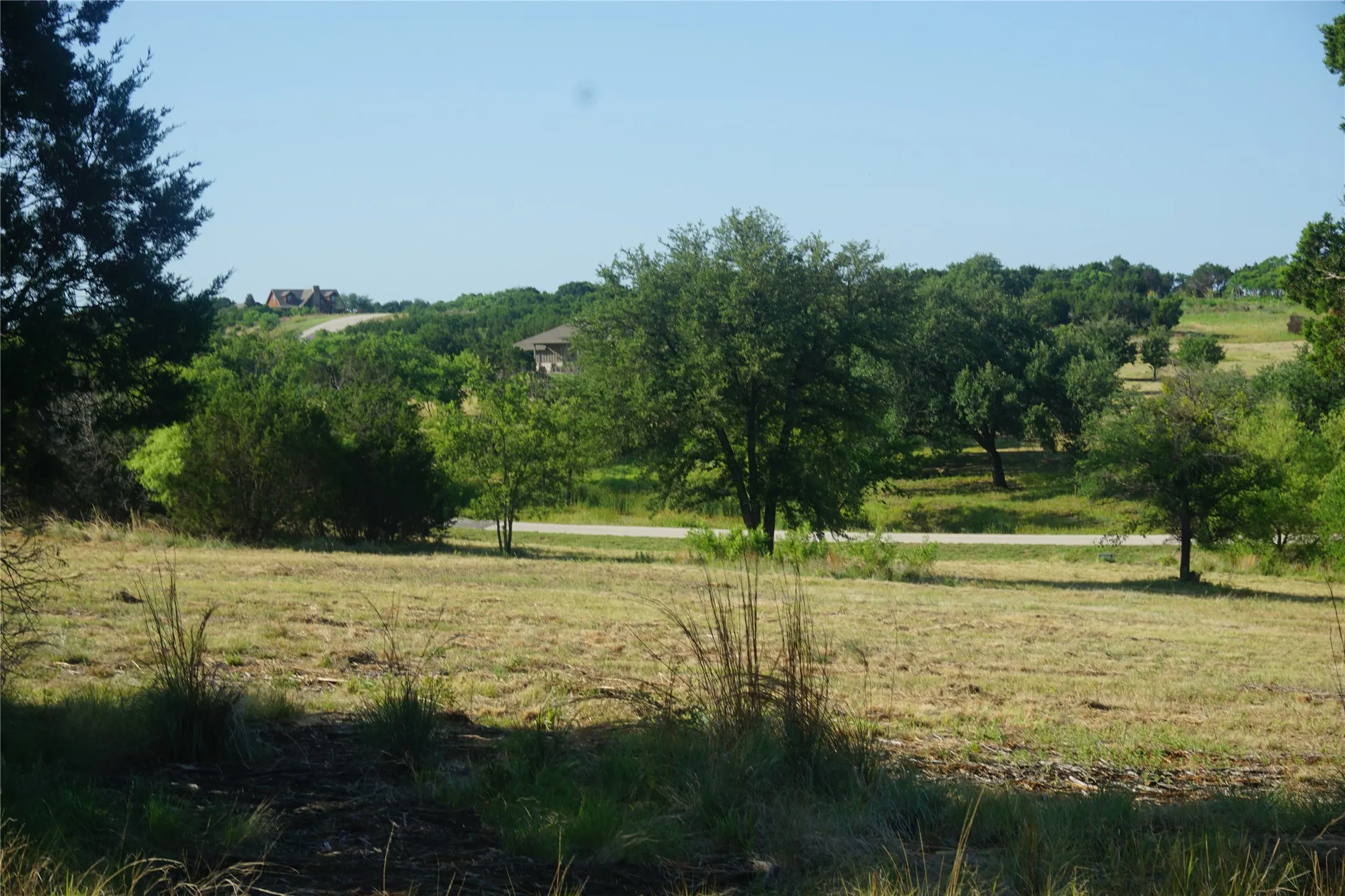 Taken from the front 1/3rd of the land. You can see Enchanted Rock Court and the beautfy of the surrounding area.