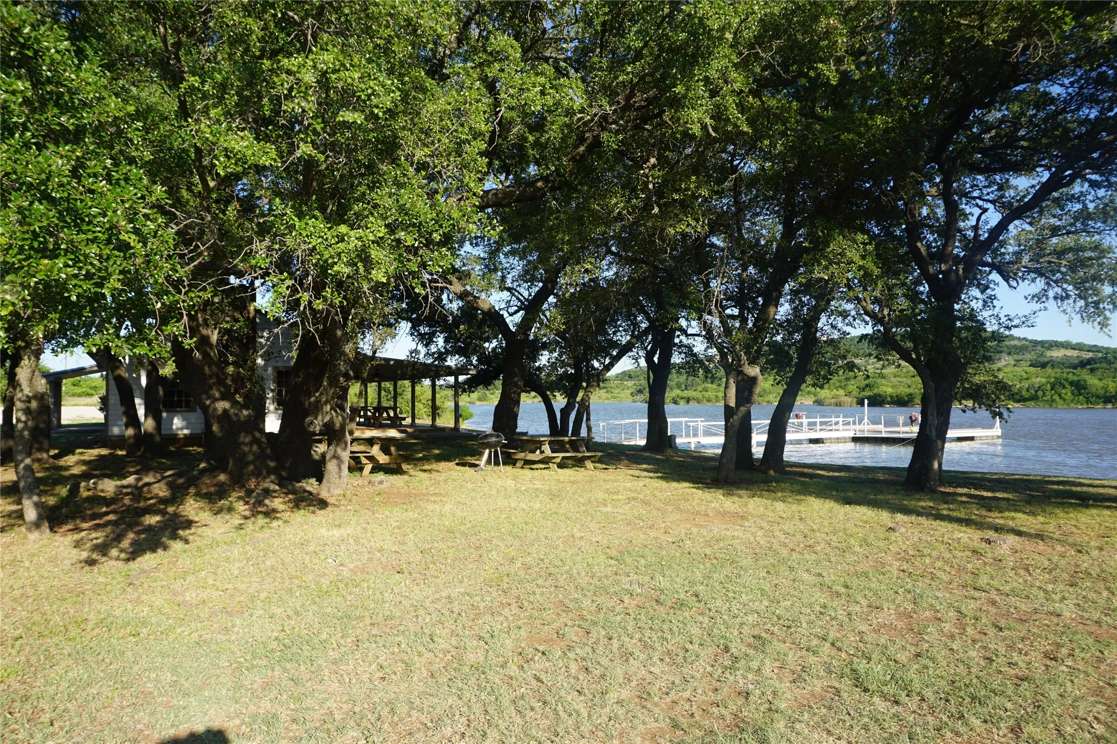 Serene community Lake Ritchie Cabin is nestled under a grove of mature oak trees.