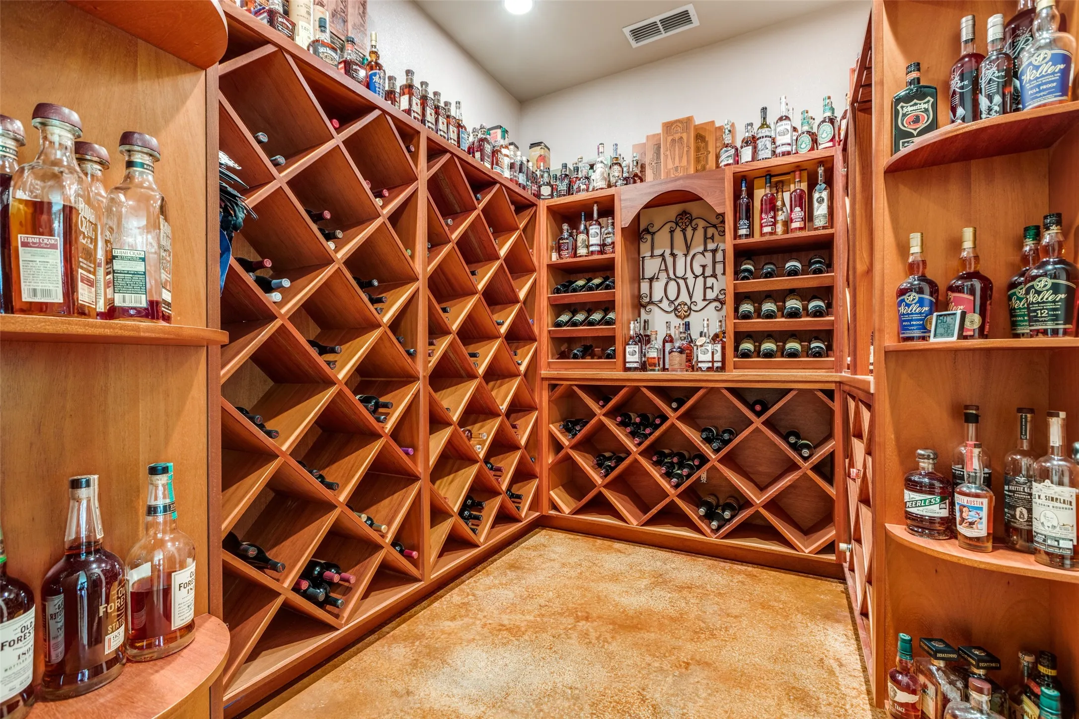 Wine room featuring light colored carpet