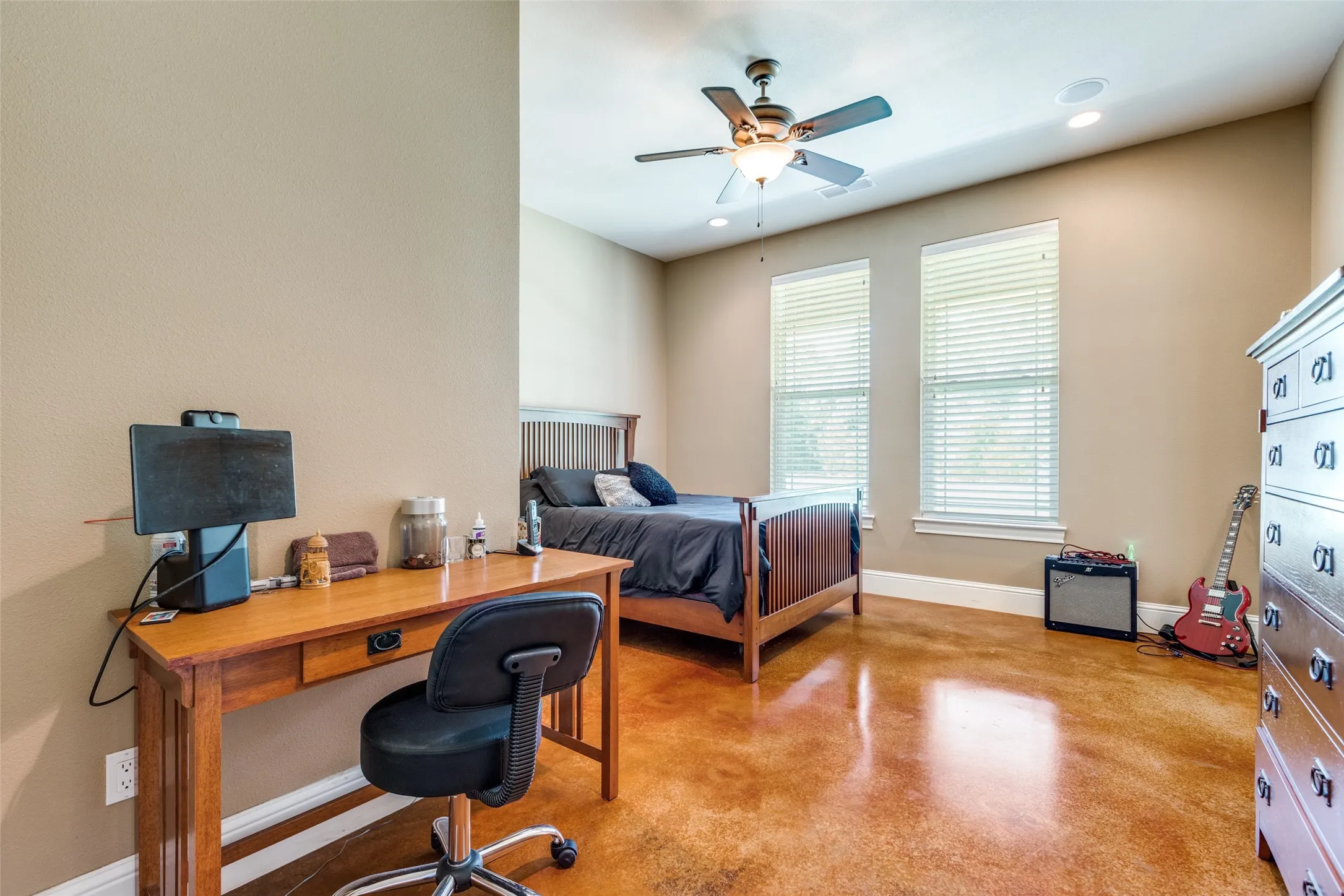 Bedroom featuring finished concrete floors, a ceiling fan, and recessed lighting
