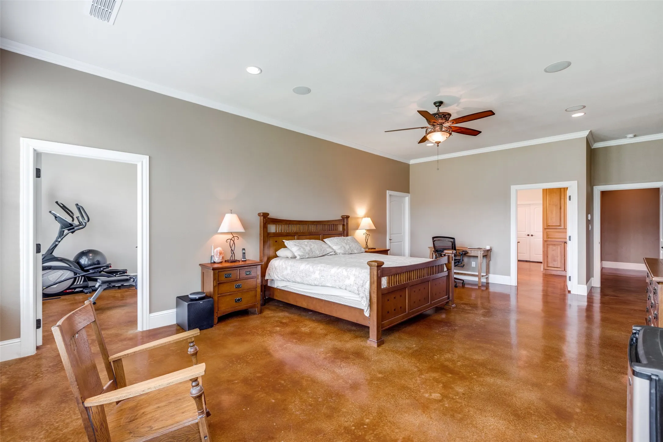 Bedroom featuring ornamental molding, concrete flooring, recessed lighting, ceiling fan, and an office area
