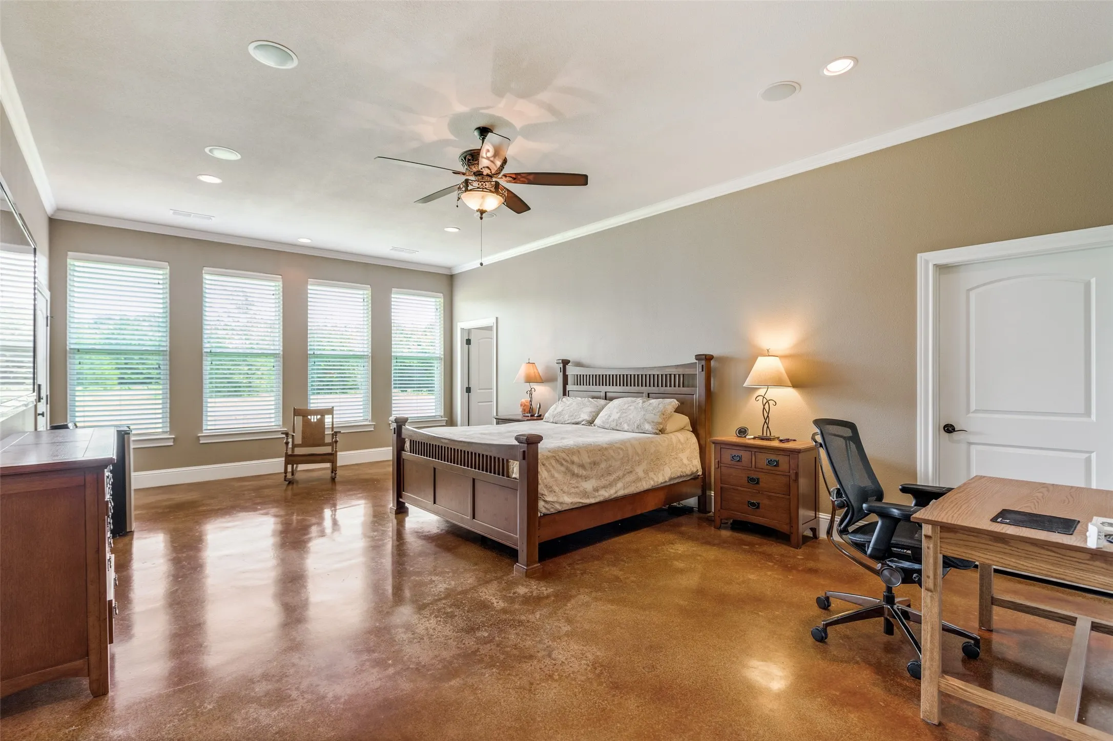 Bedroom with a desk, finished concrete floors, ornamental molding, recessed lighting, and a ceiling fan