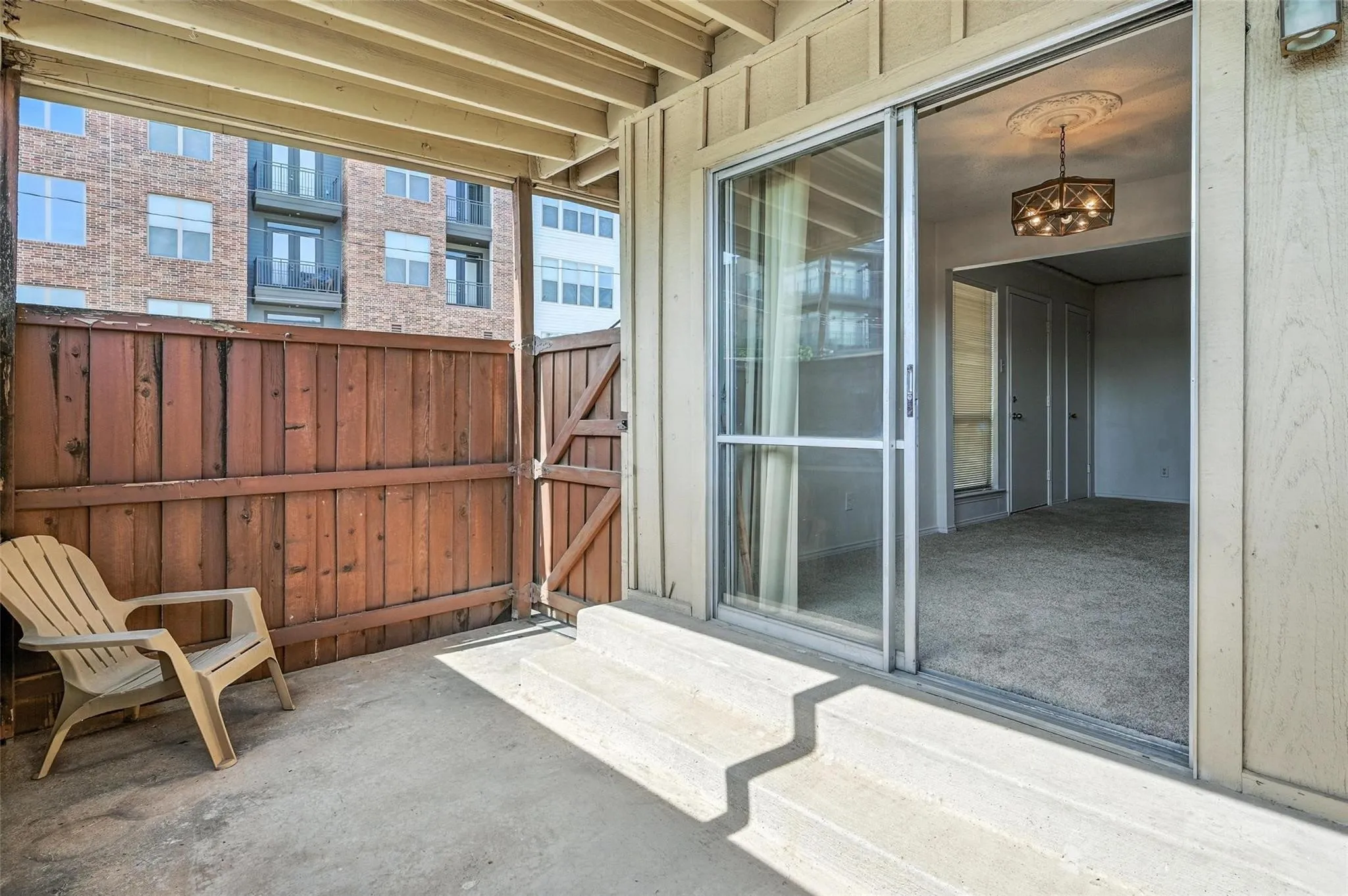 Opens to carport space