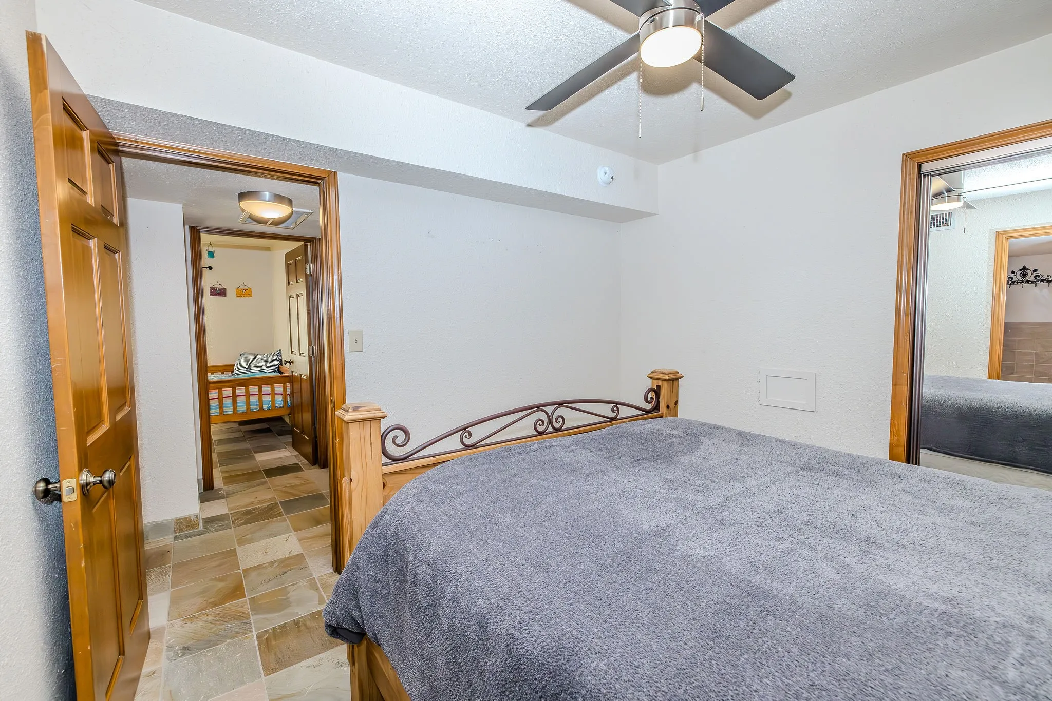 Looking from the primary bedroom across the hall to the guest room.