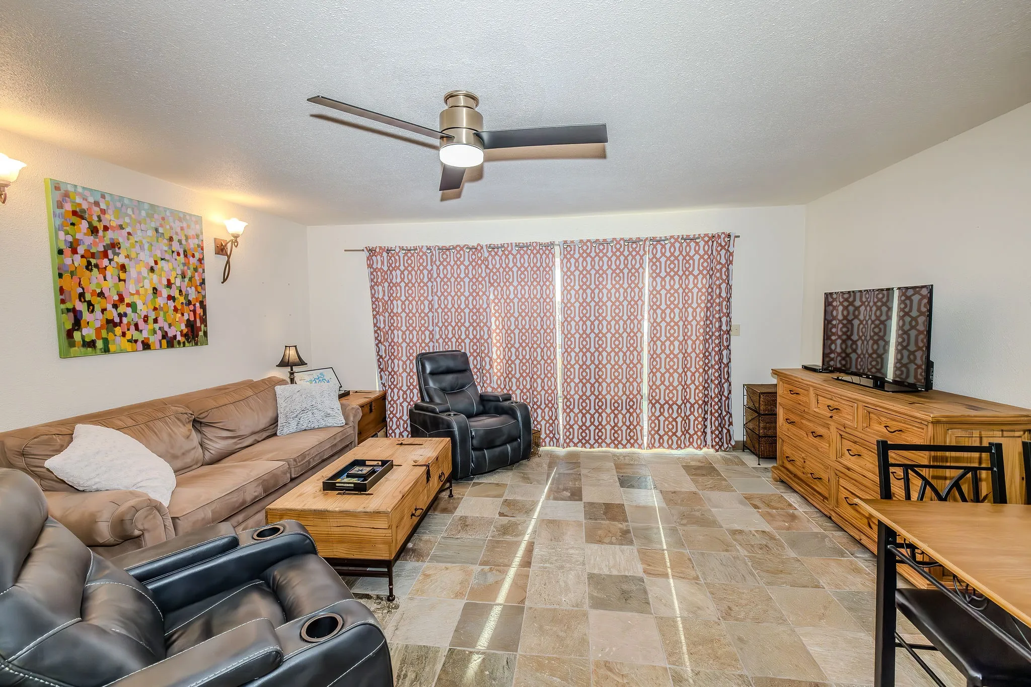 Just in case the sun is too bright, close the black out drapes and enjoy the spacious living area.