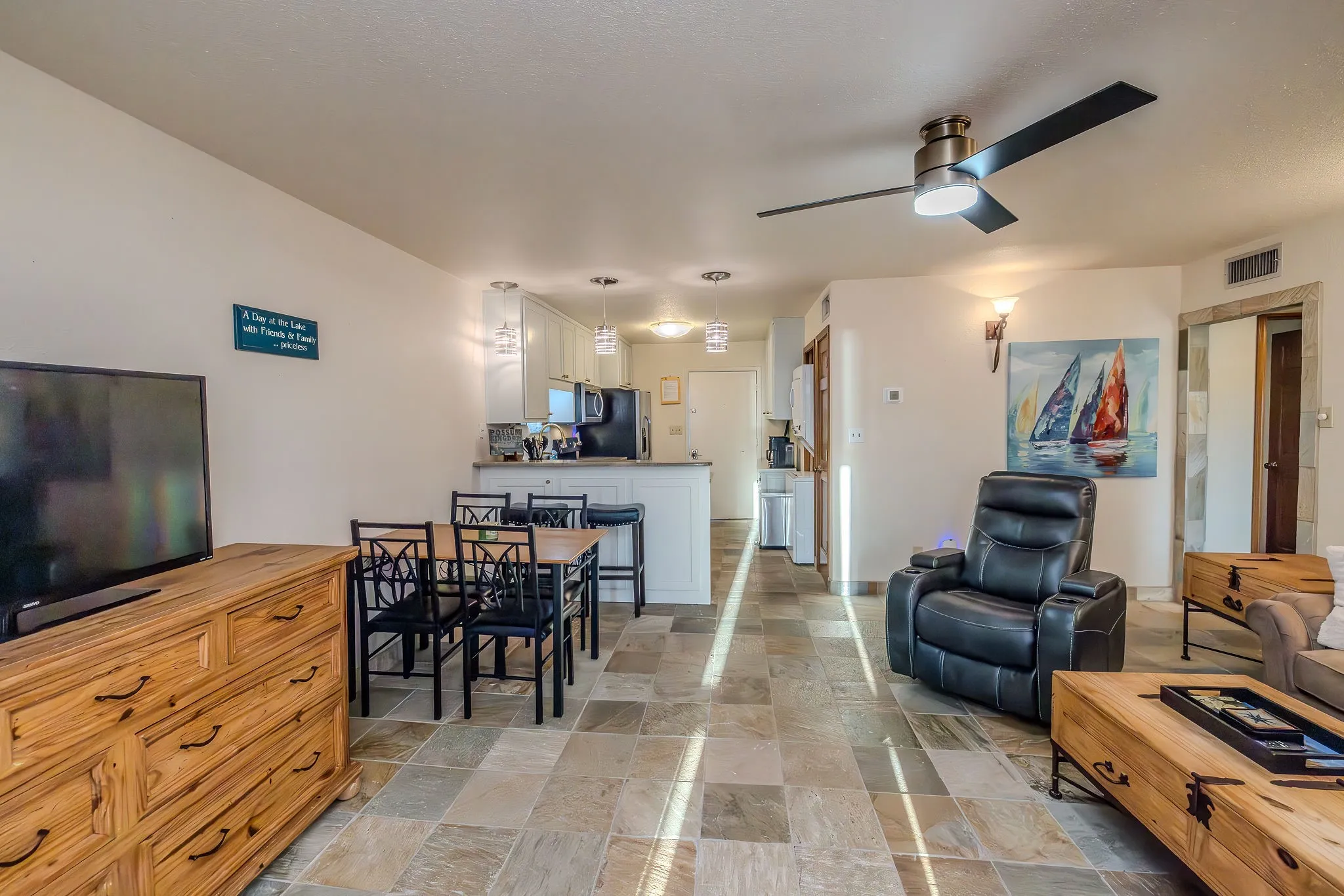 The open concept floor plan with the dining area and breakfast bar gives you plenty of room for seating for meals, games, conversation, or movie nights.