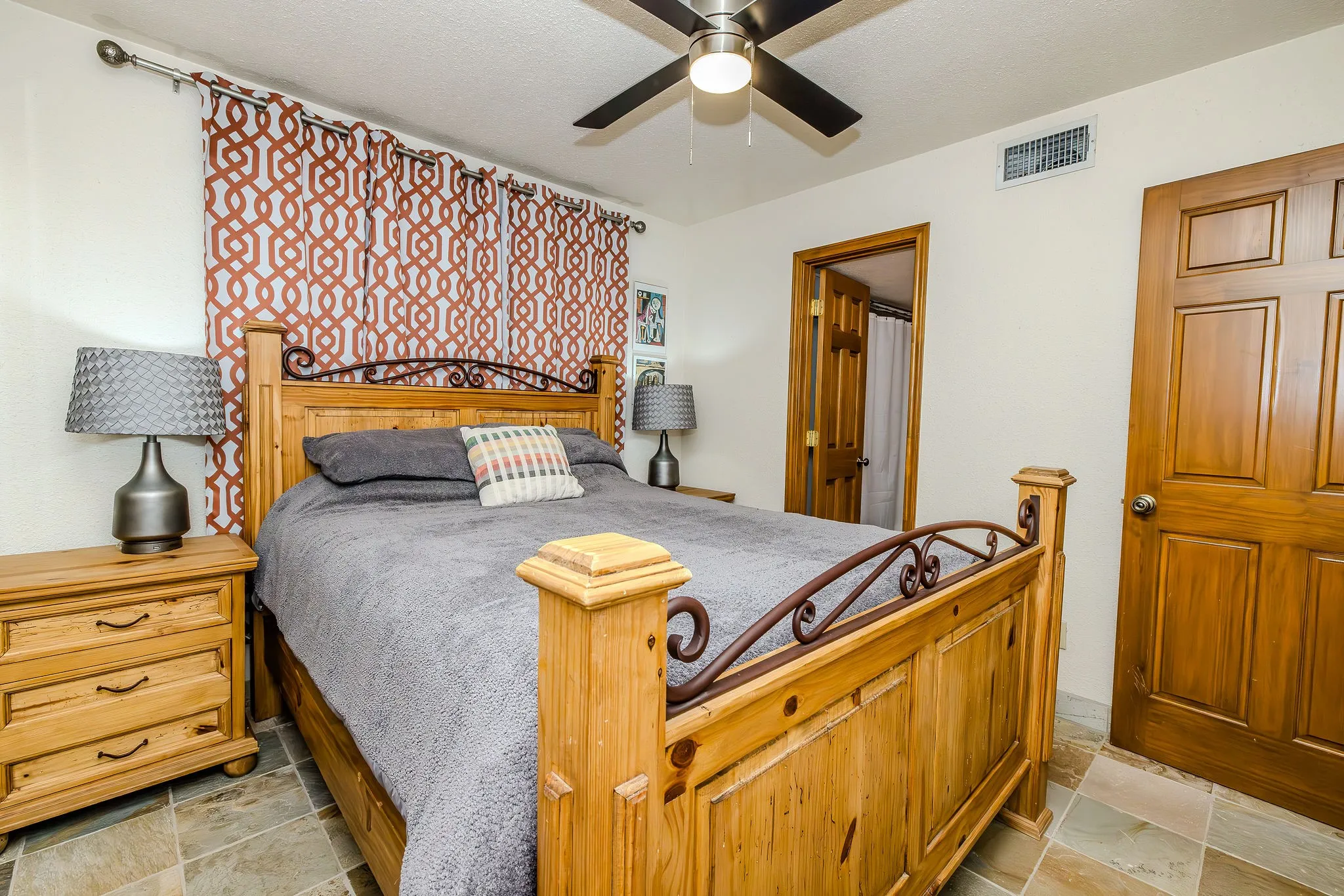 This bedroom features an en-suite bath.