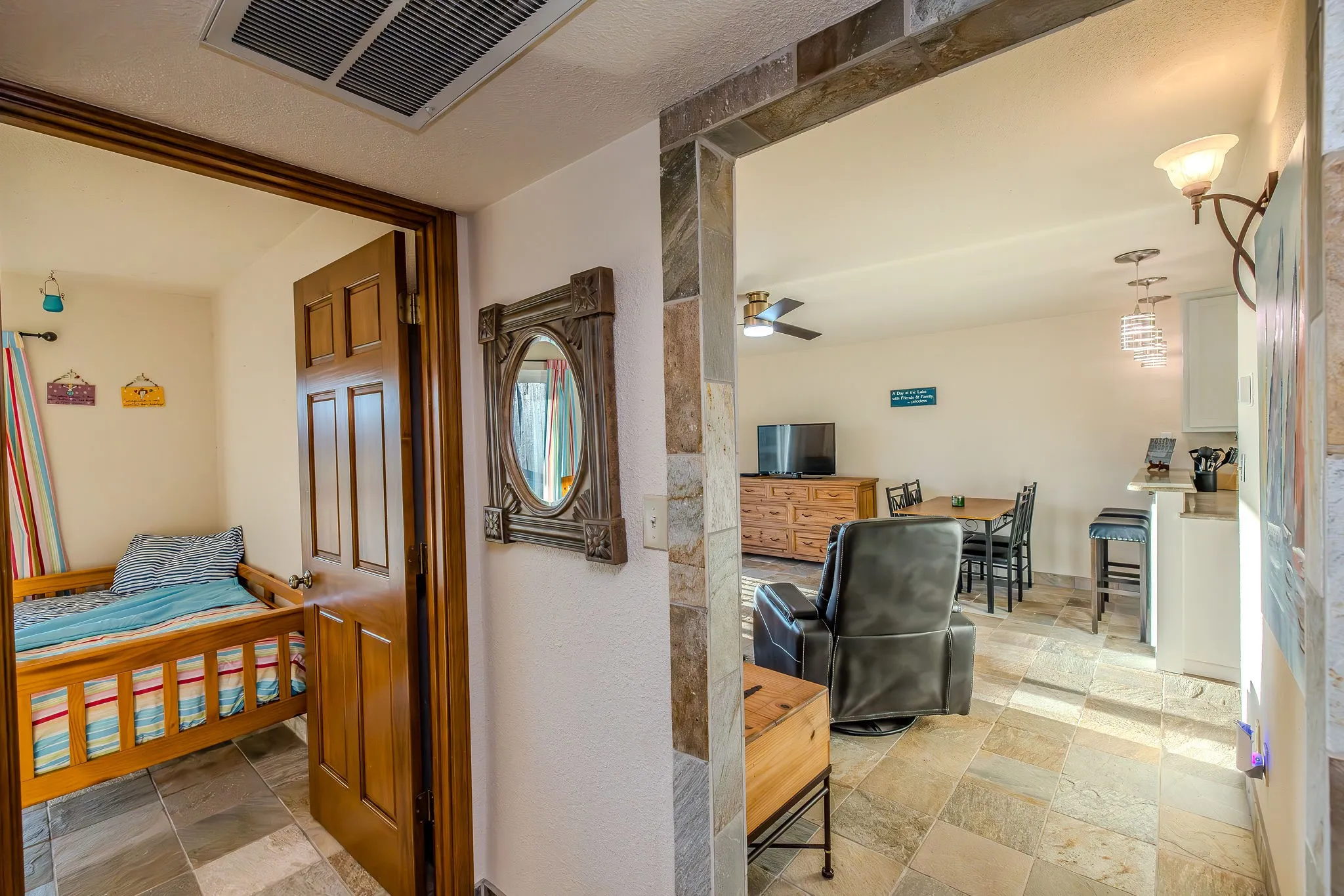 View from the hallway to the living room and guest room.