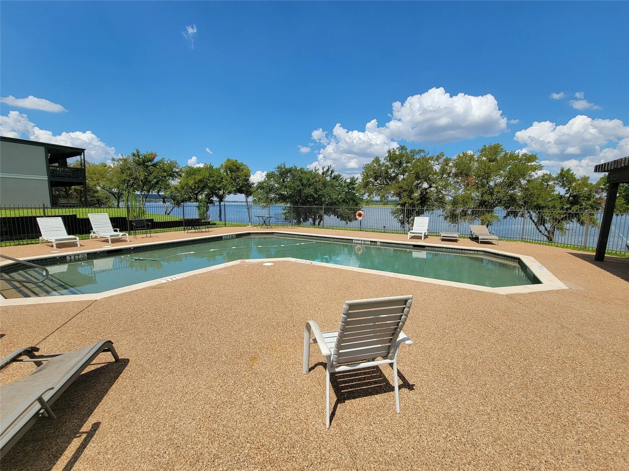 Another of the great amenities for Landing Condo owners is the community pool overlooking the lake.