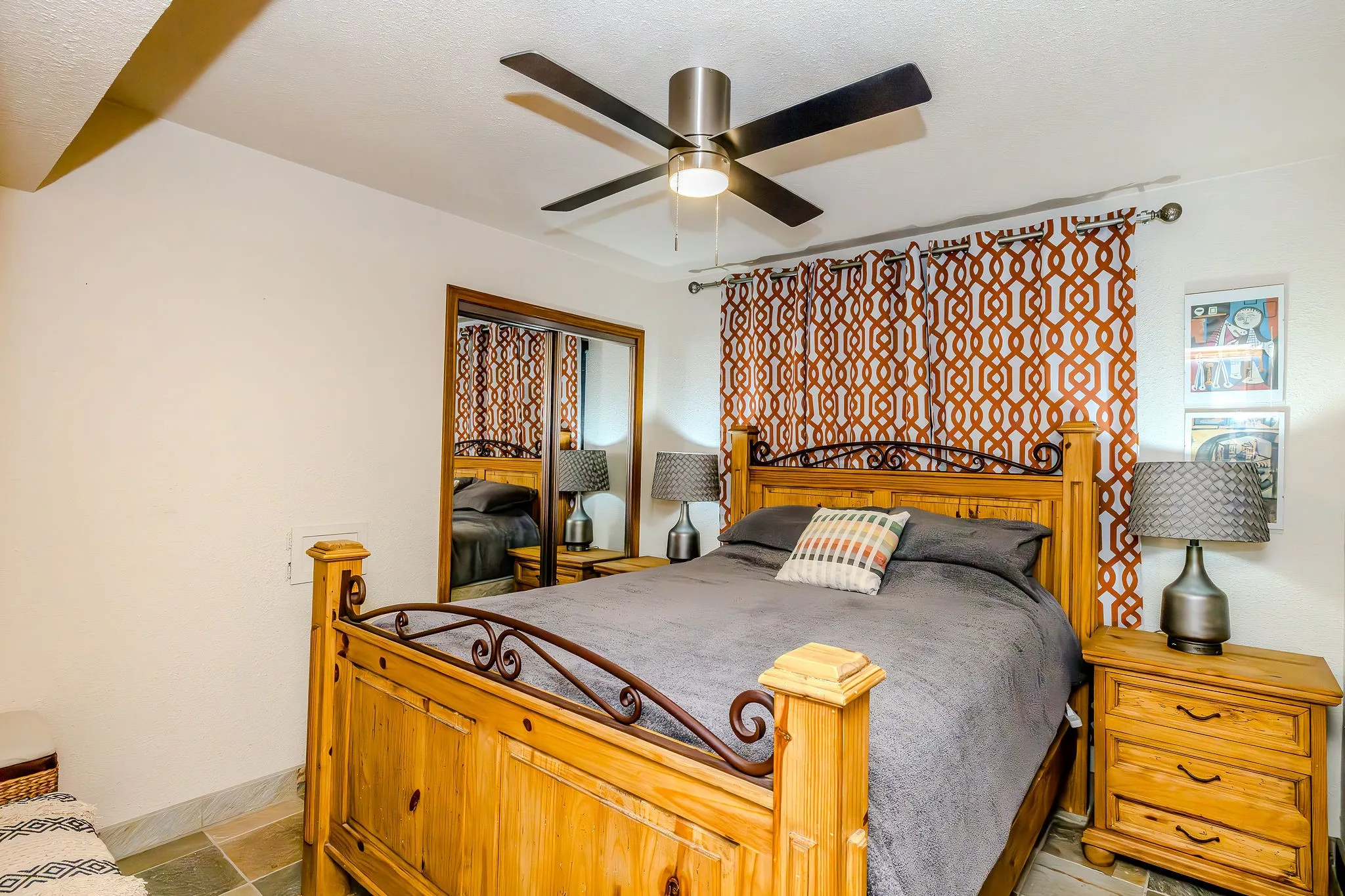 The primary bedroom features a nice size mirrored closet and new window with a custom blind and black out drapes.