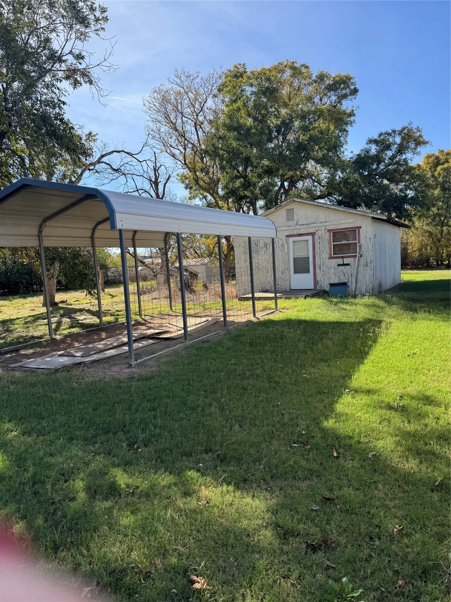 Extra carport by shop