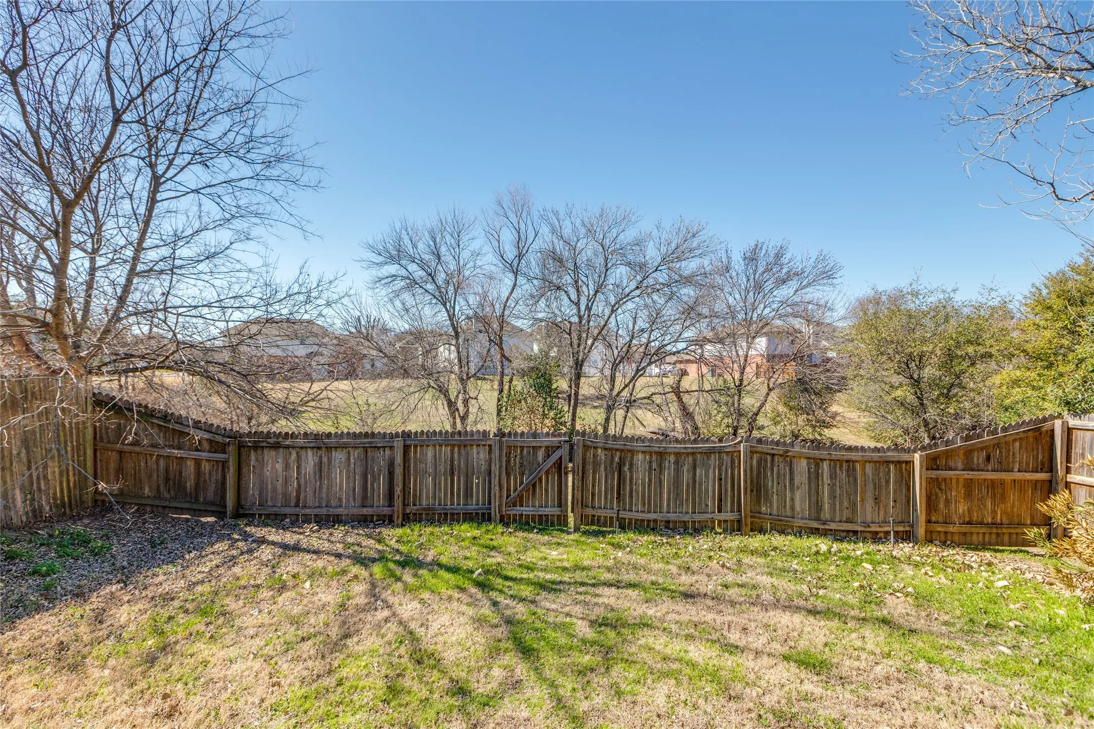 Spacious fenced in backyard.