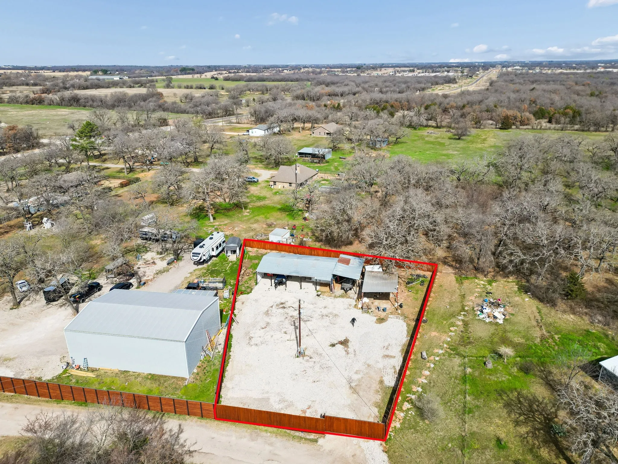 Aerial view of property and surrounding area featuring property boundaries highlighted