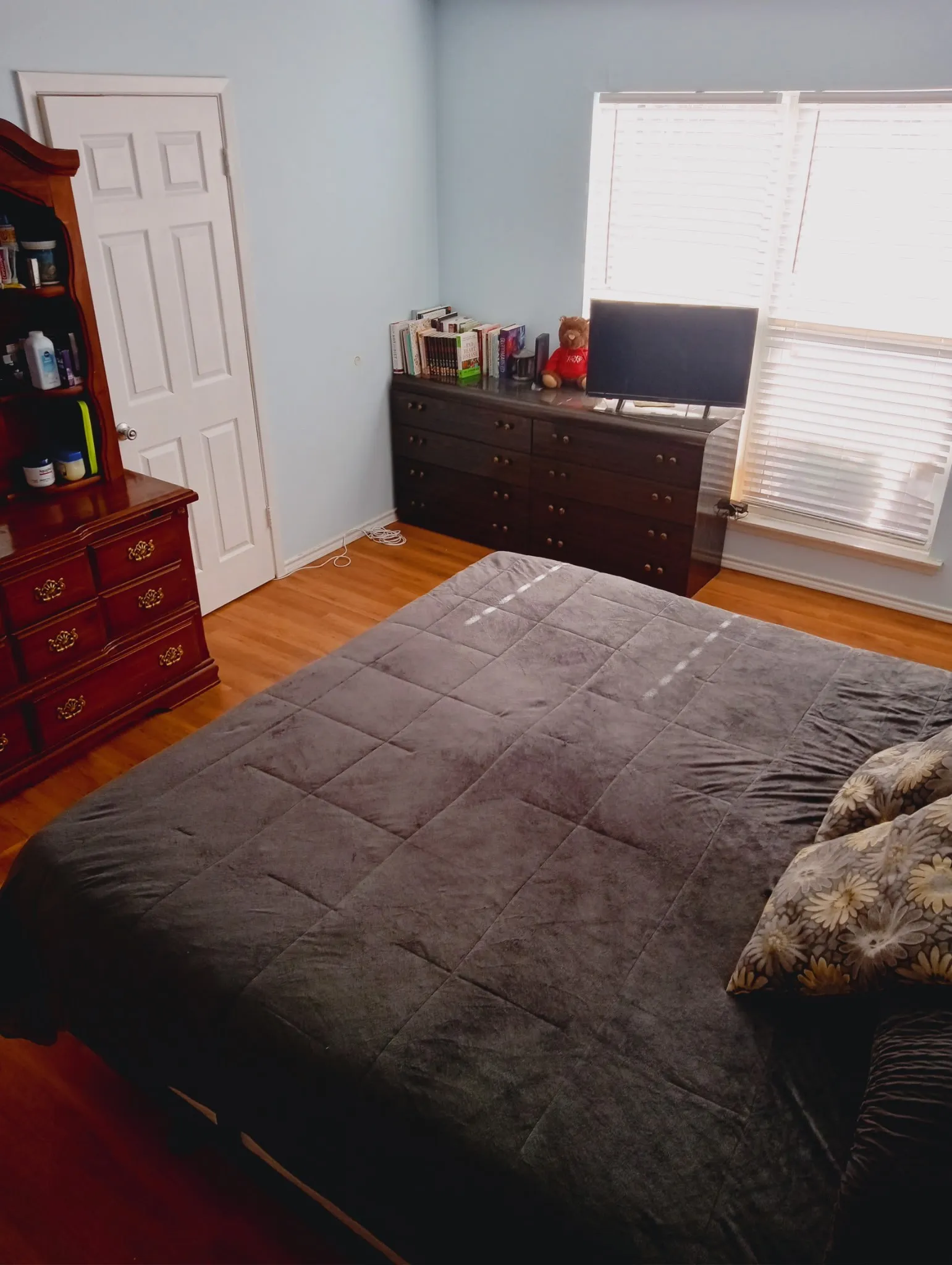Bedroom with light wood-type flooring and baseboards