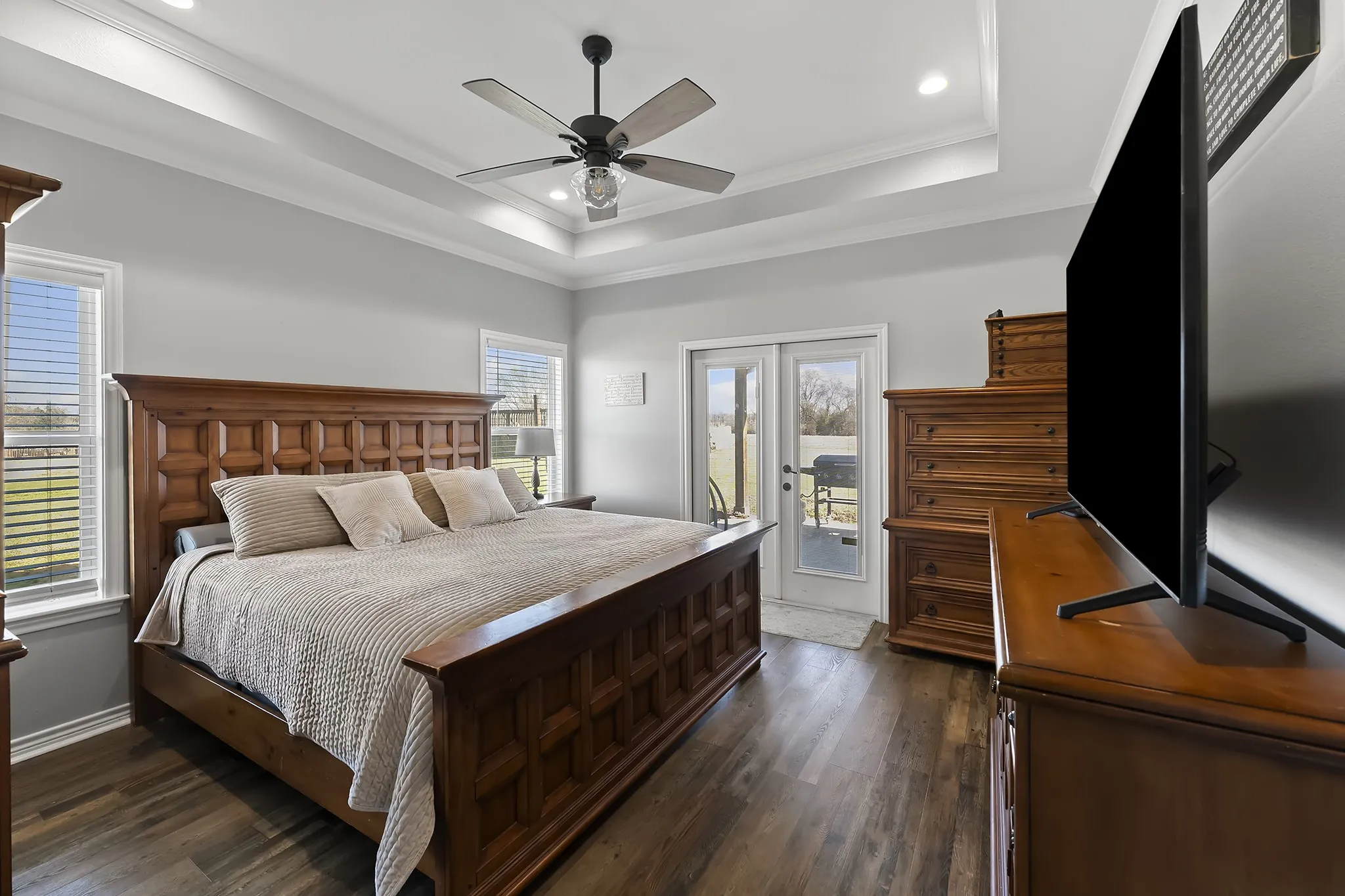 Bedroom with dark wood finished floors, crown molding, access to outside, ceiling fan, and recessed lighting