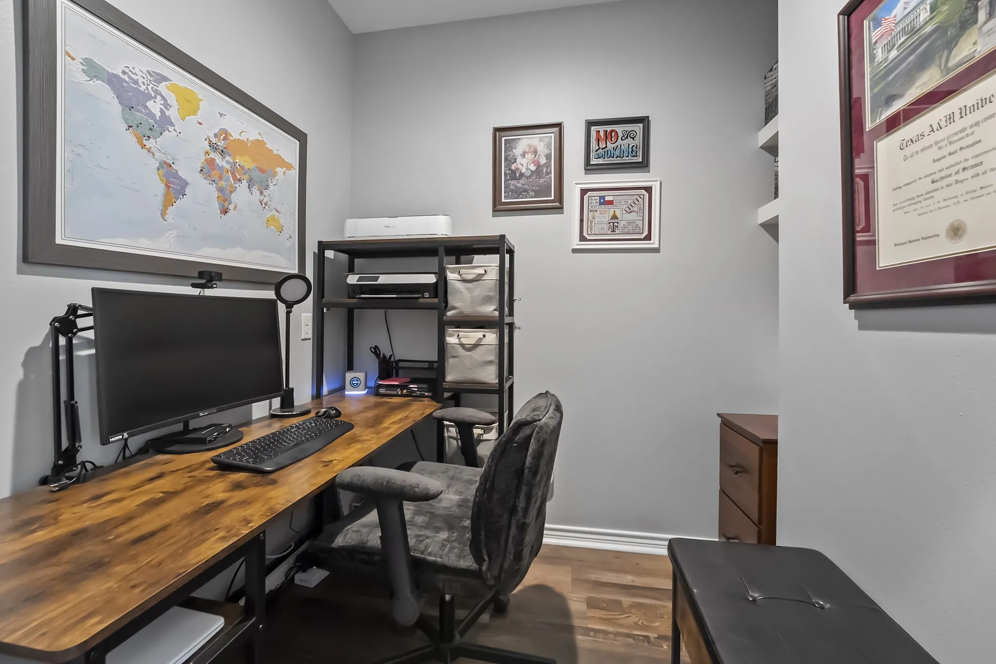 Office space featuring dark wood-style floors and baseboards